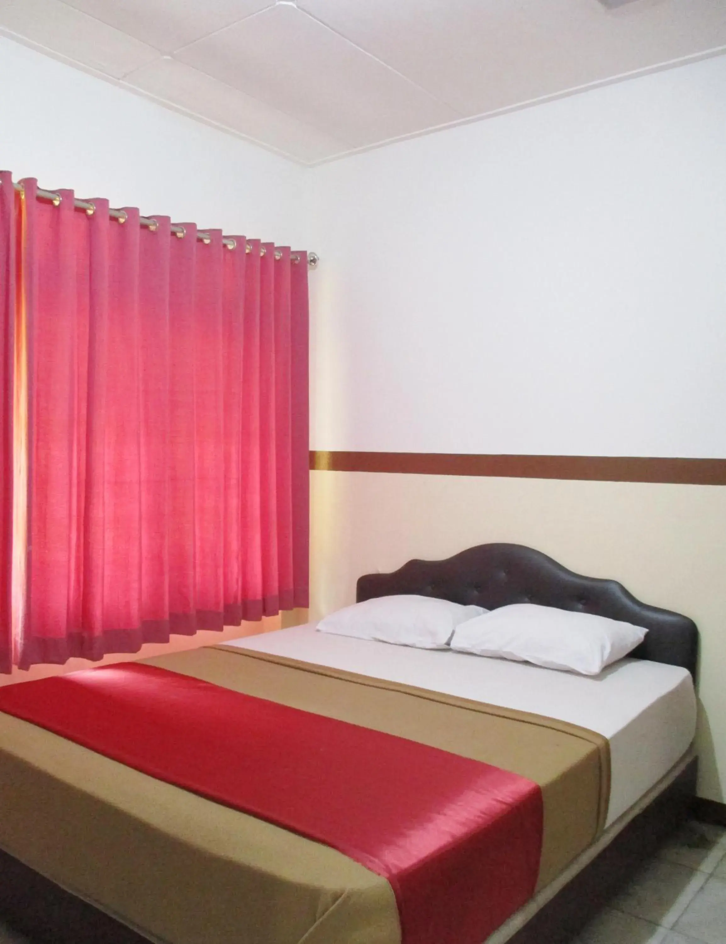 Bed in Hotel Tugu Asri