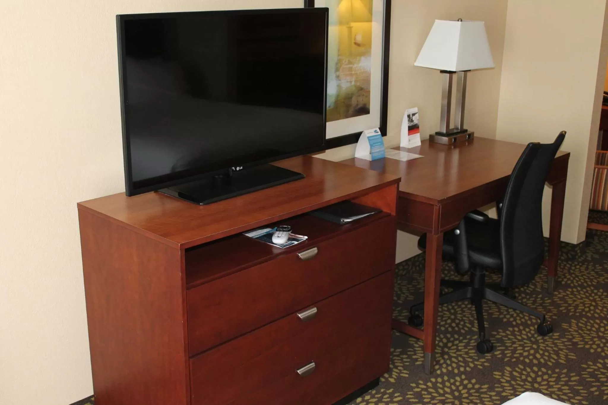 Photo of the whole room, TV/Entertainment Center in Holiday Inn Express Hotel & Suites Starkville, an IHG Hotel