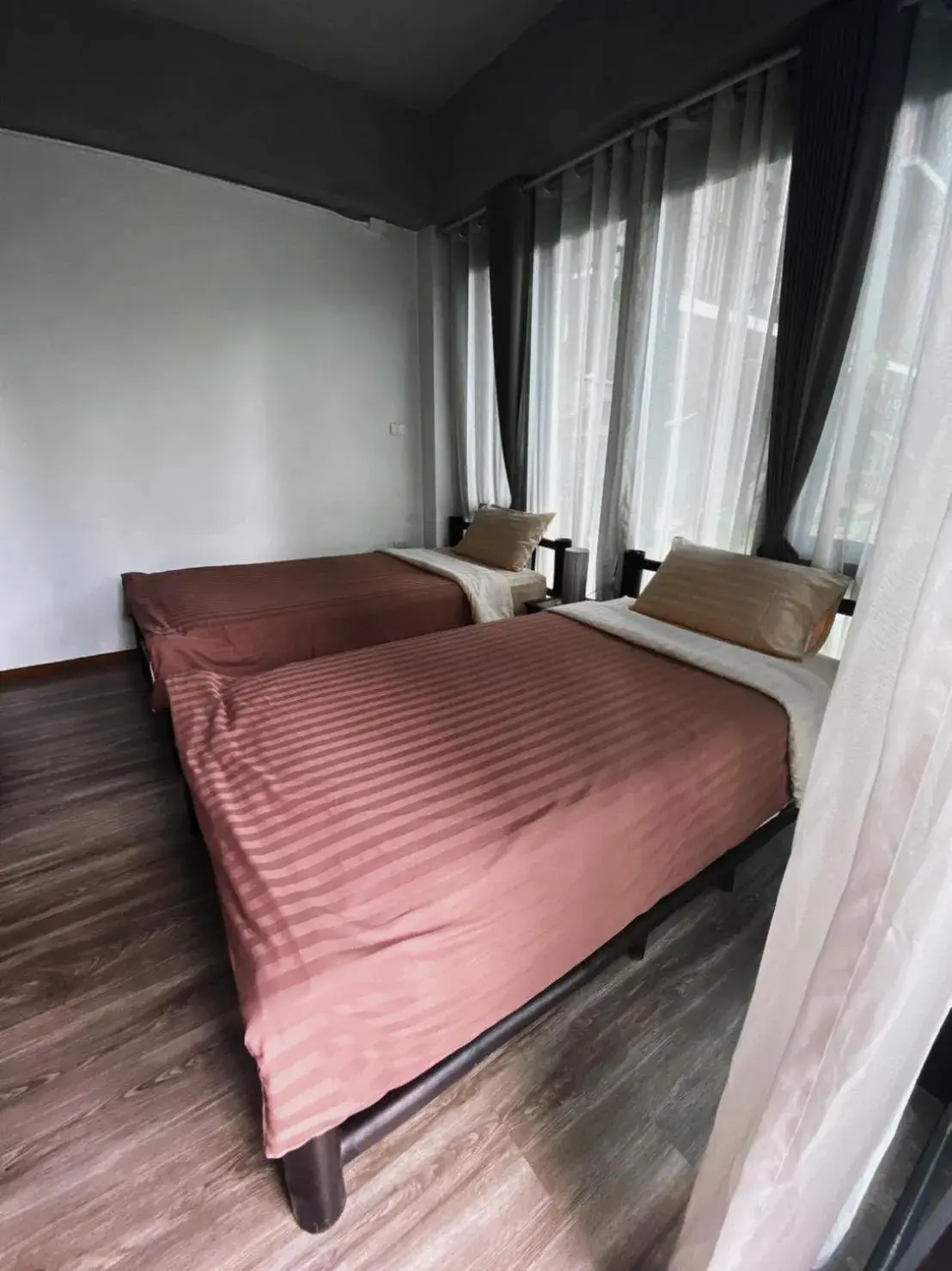 Bed in Lamphu House Chiang Mai - SHA Extra Plus Certified