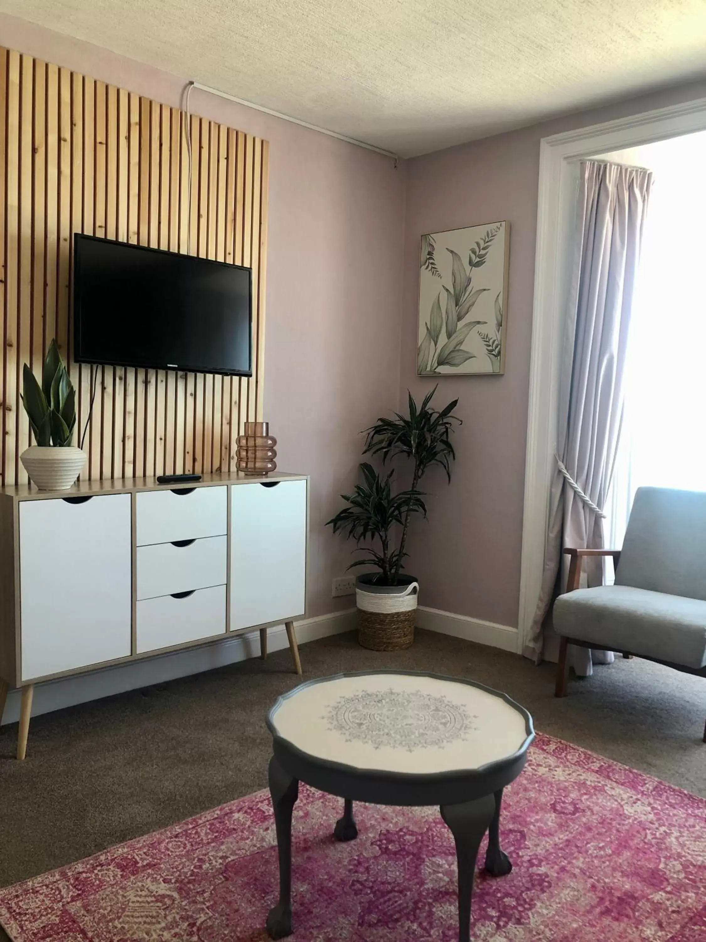 Seating area, TV/Entertainment Center in Cranwell Court Apartments