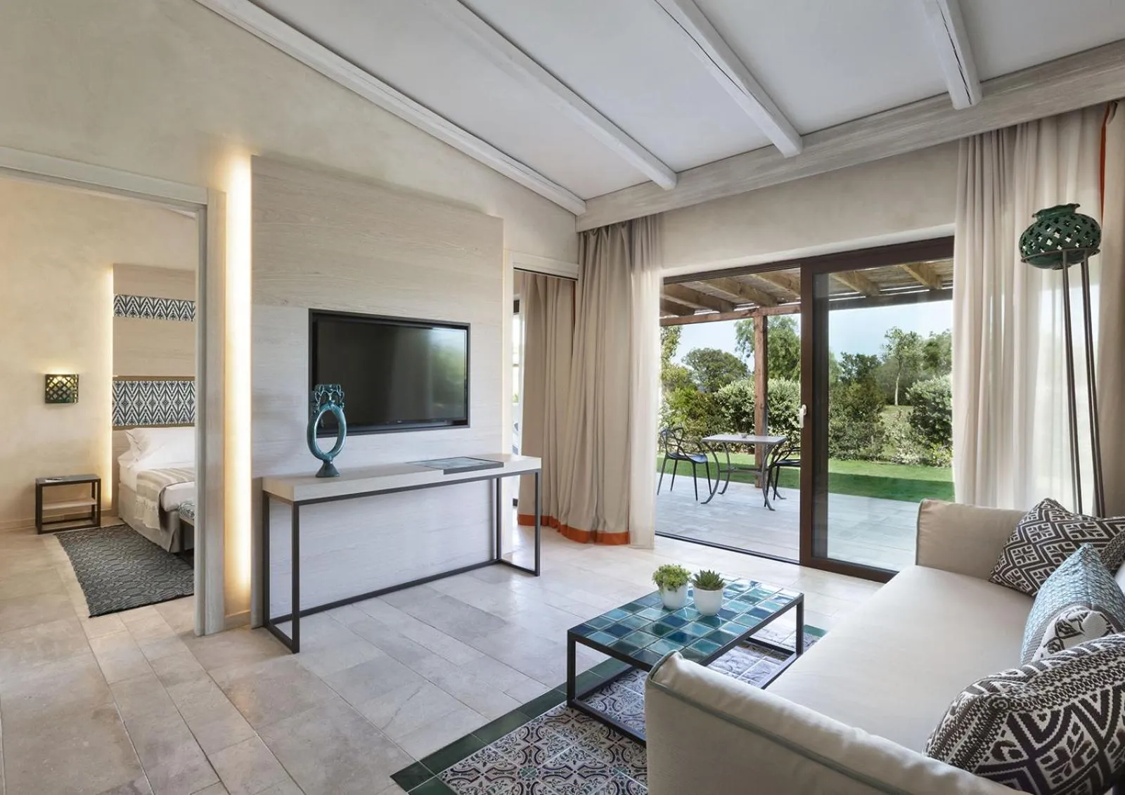 Living room, Bed in Baglioni Resort Sardinia - The Leading Hotels of the World