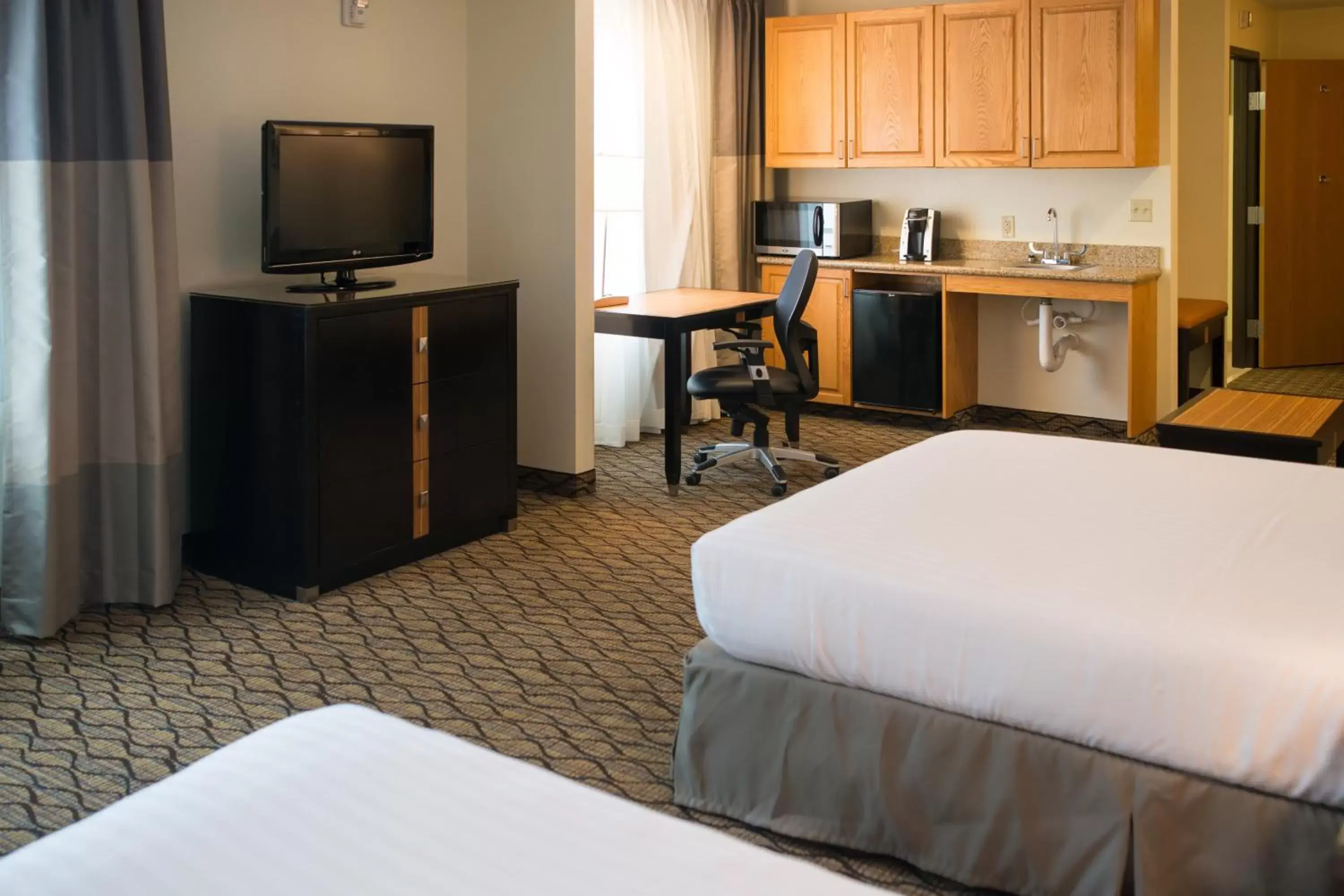 Photo of the whole room, TV/Entertainment Center in Holiday Inn Express Hotel & Suites Chanhassen, an IHG Hotel