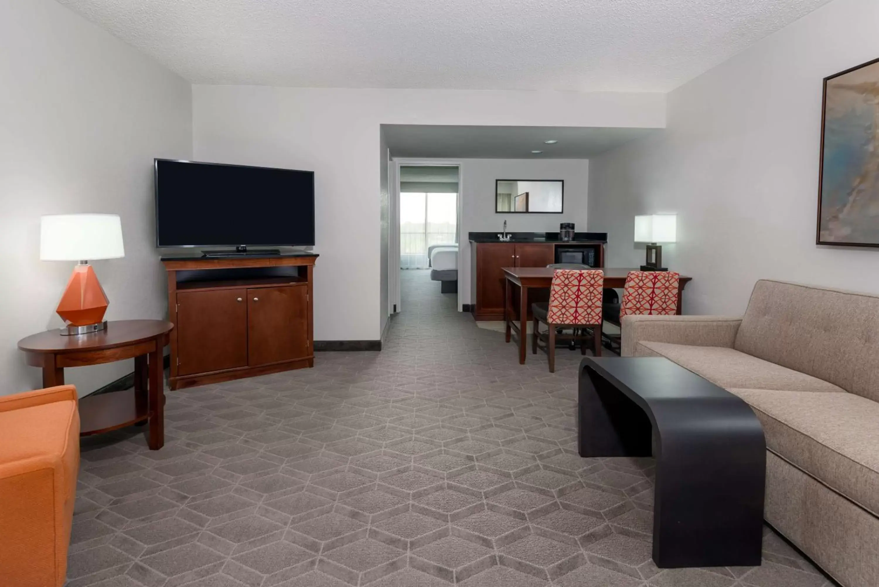 Living room, TV/Entertainment Center in Embassy Suites Dallas - Park Central Area