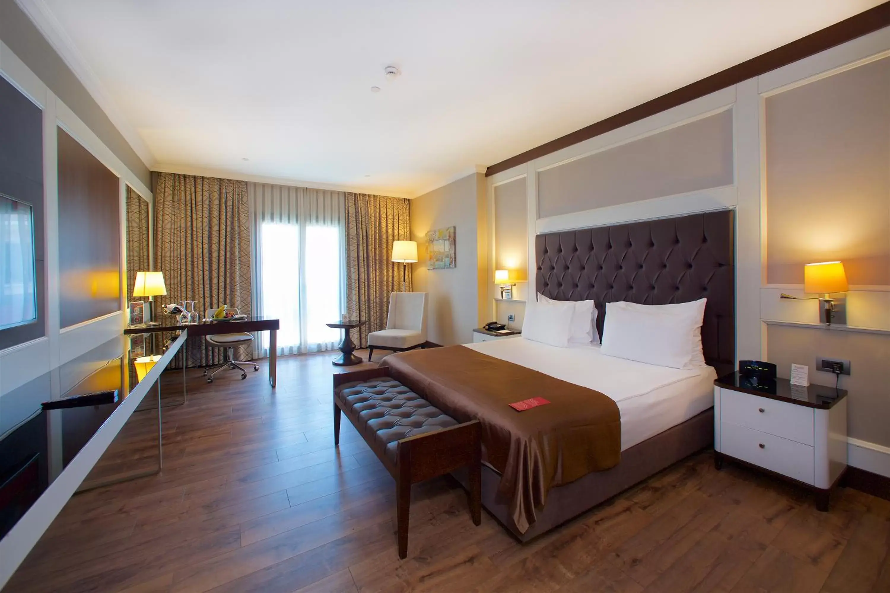Communal lounge/ TV room in Ramada Hotel & Suites by Wyndham Istanbul Merter