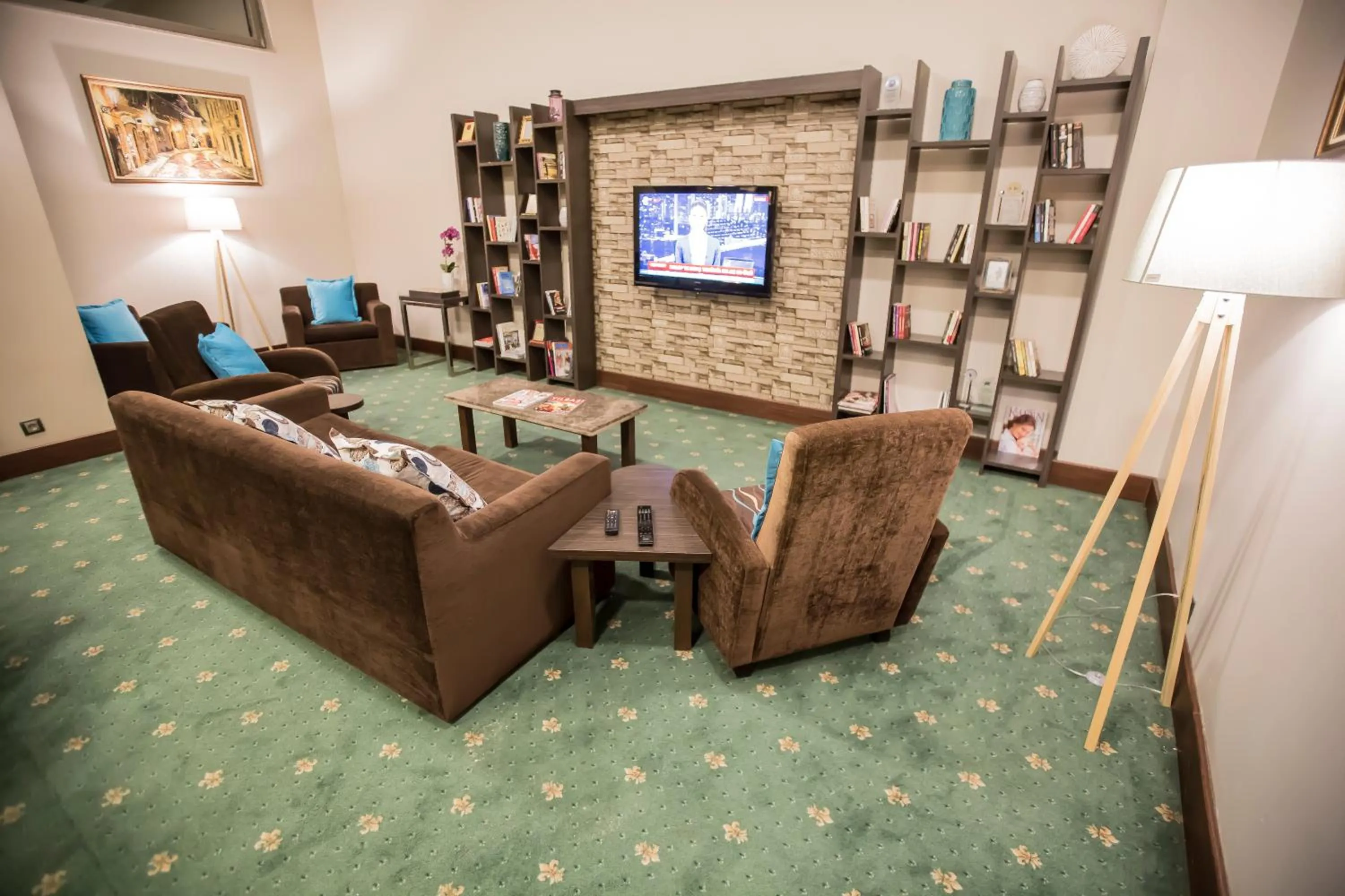 Communal lounge/ TV room in North Point Hotel