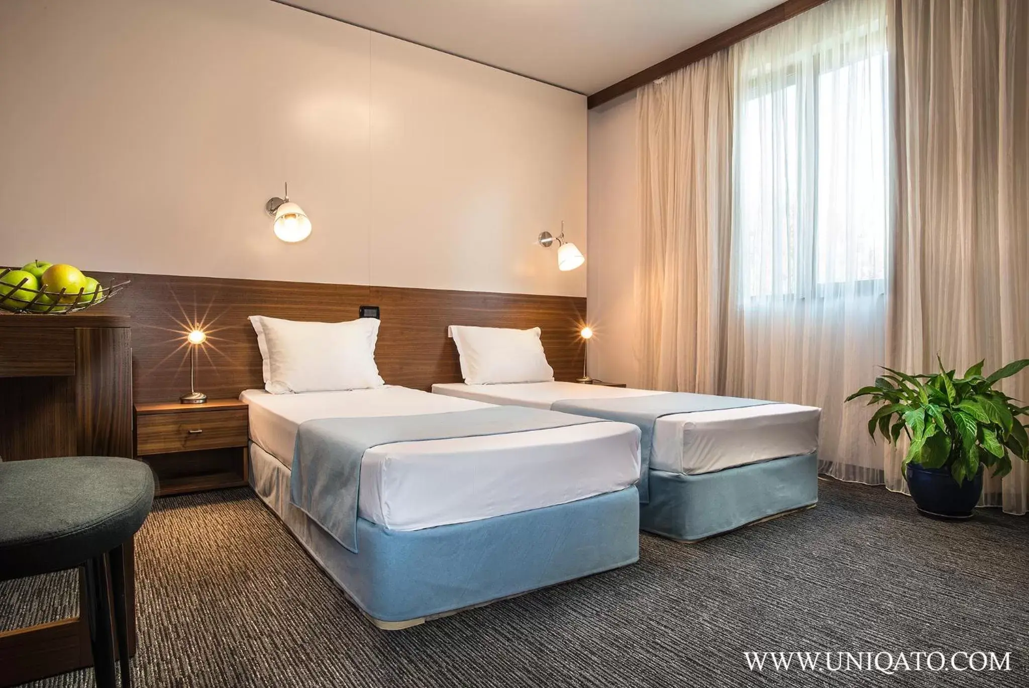 Bed in Uniqato Hotel