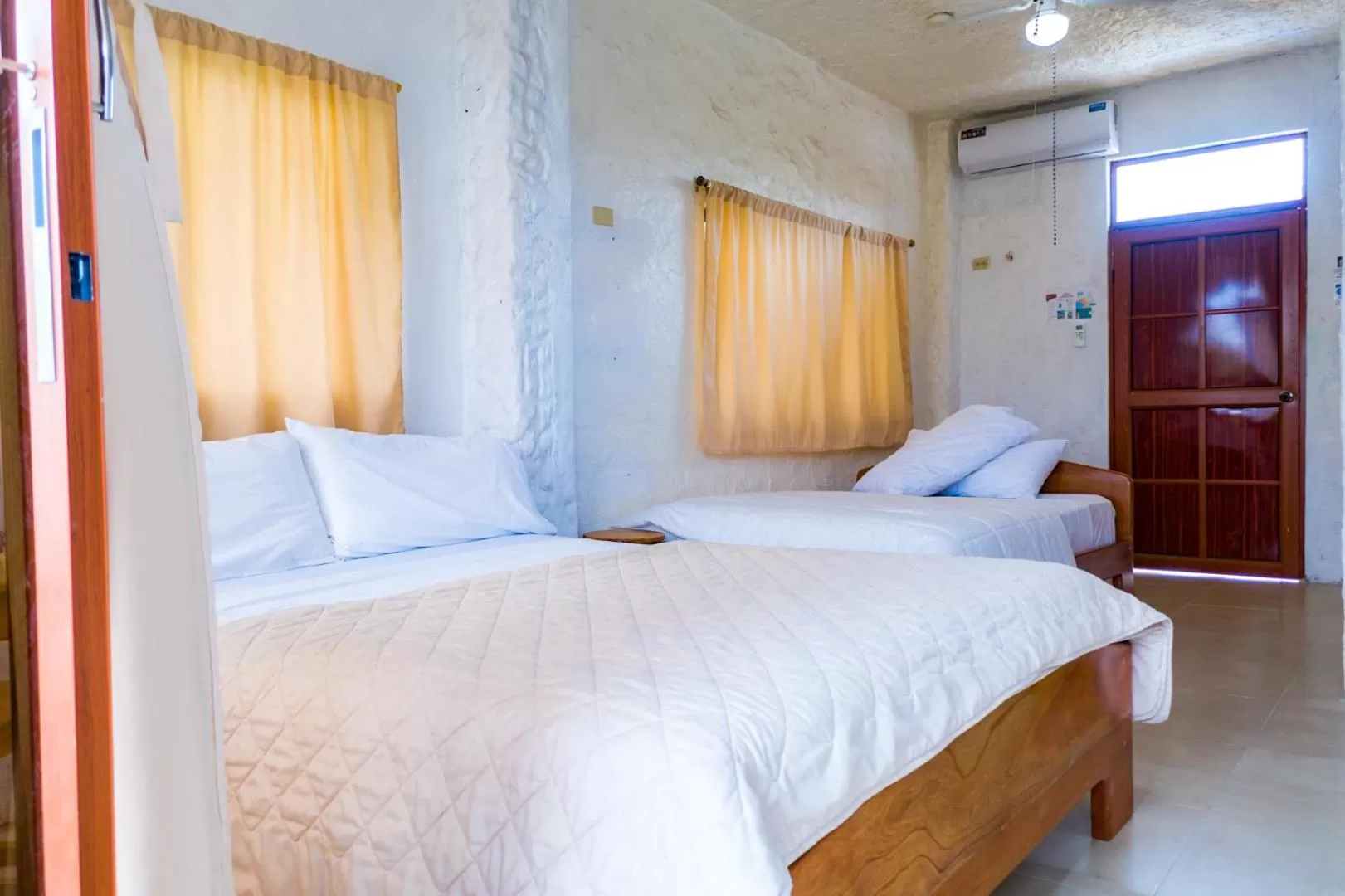 Bed in Royal Galápagos Inn