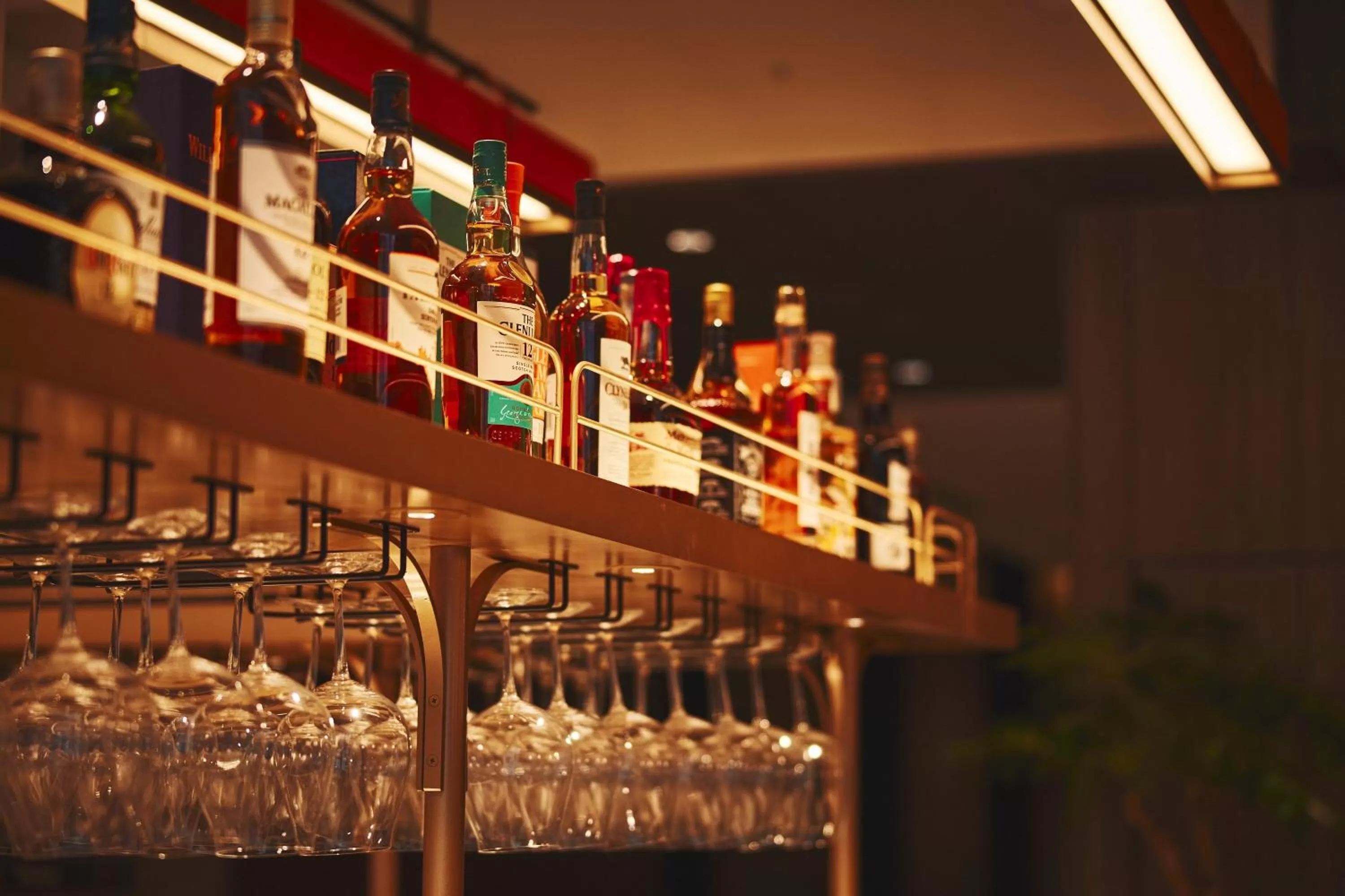 Lounge or bar in voco Osaka Central by IHG