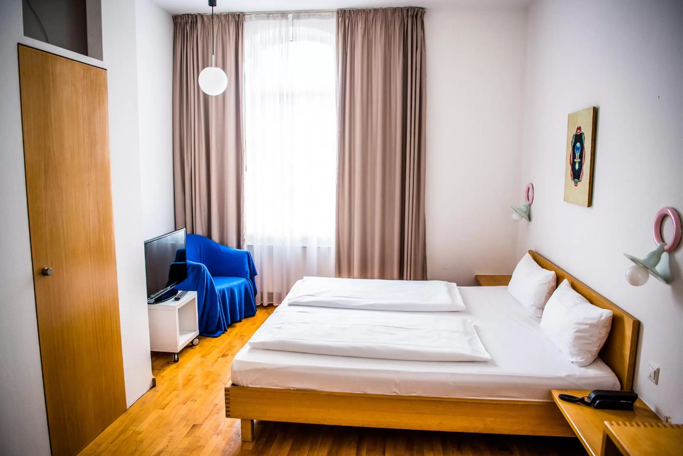 Bed in Art-Hotel Robert Mayer