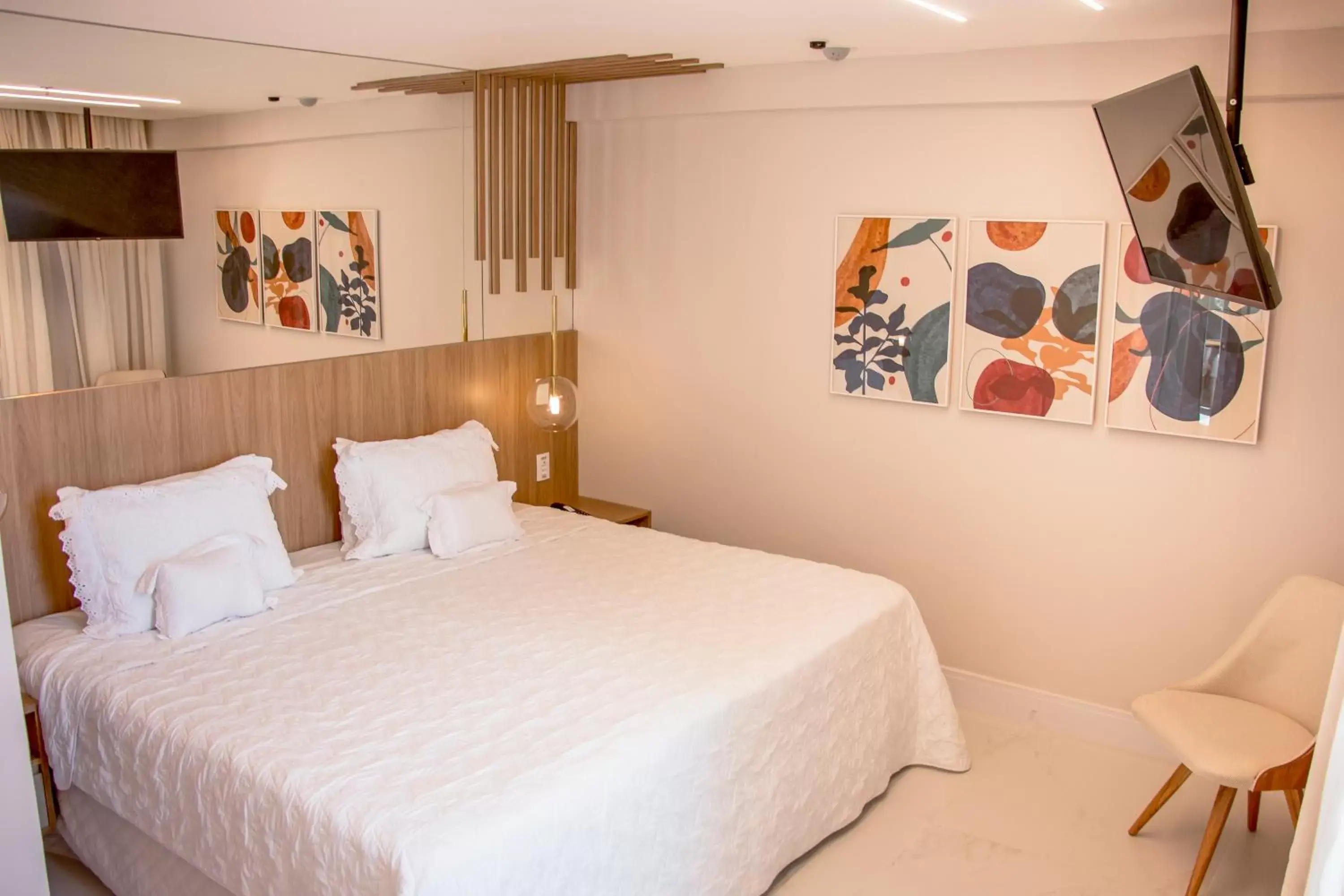 Bed in Ramada Hotel & Suites Campos Pelinca