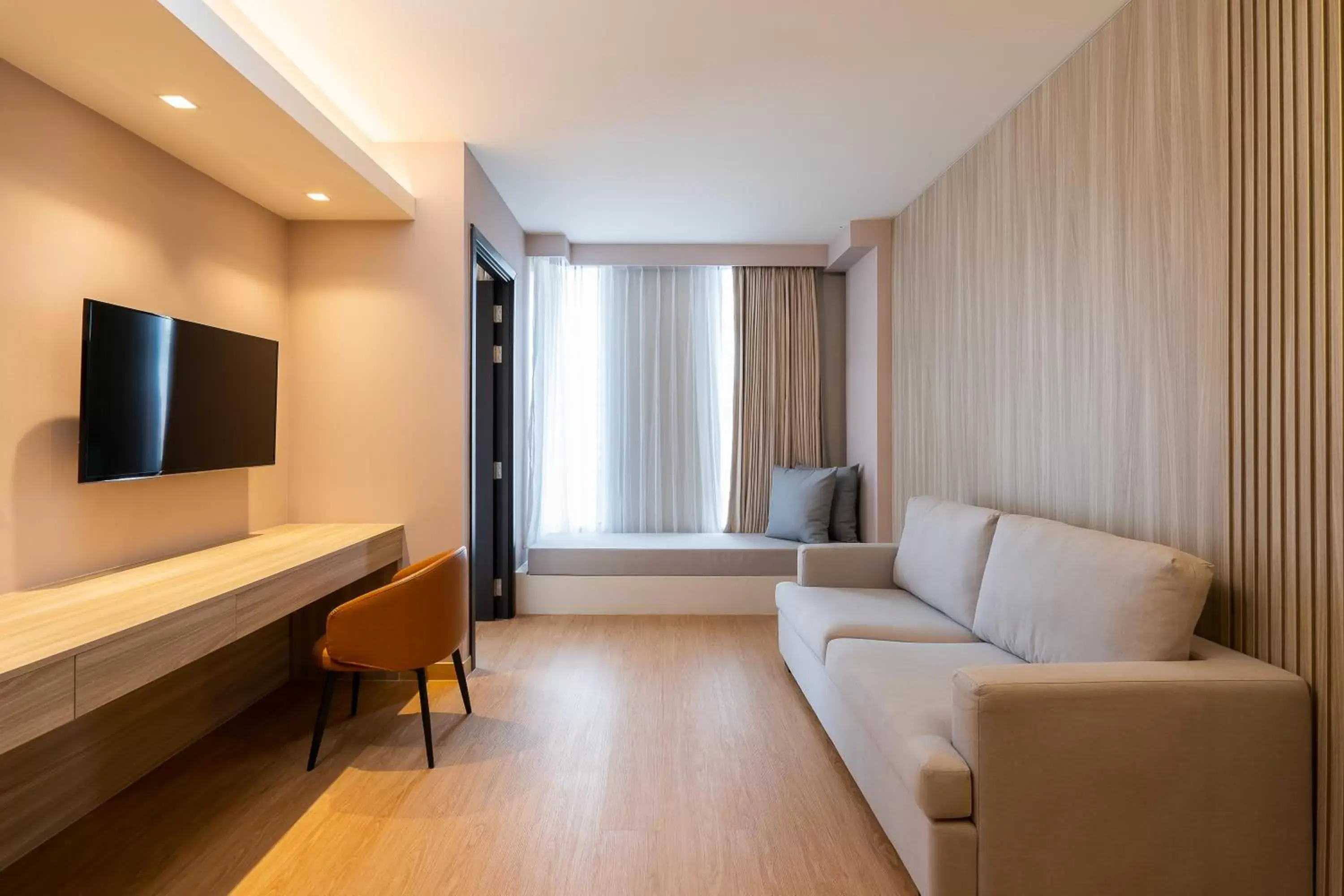 Living room, TV/Entertainment Center in Aster Hotel and Residence by At Mind