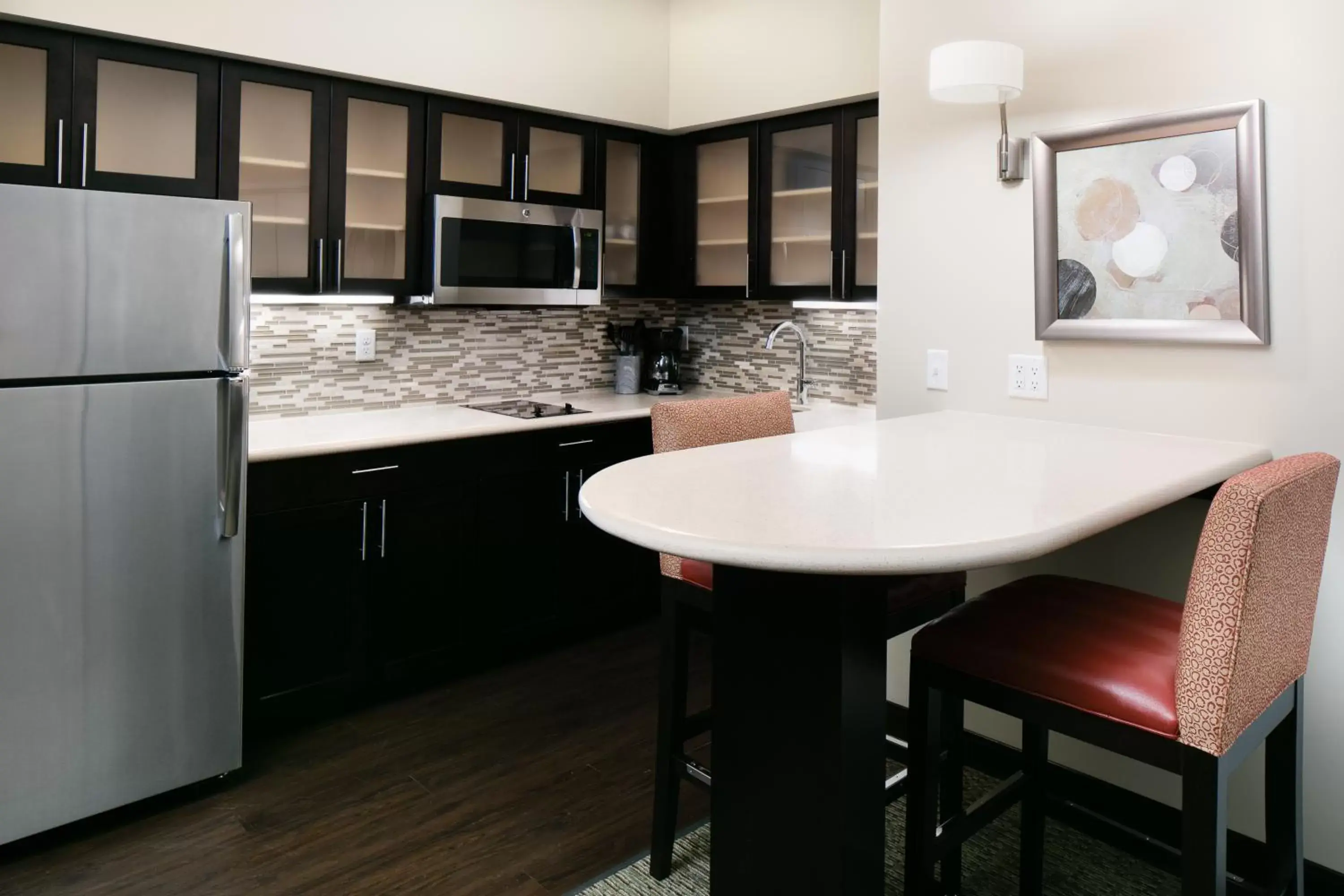 Kitchen or kitchenette, Kitchen/Kitchenette in Staybridge Suites Des Moines Downtown, an IHG Hotel