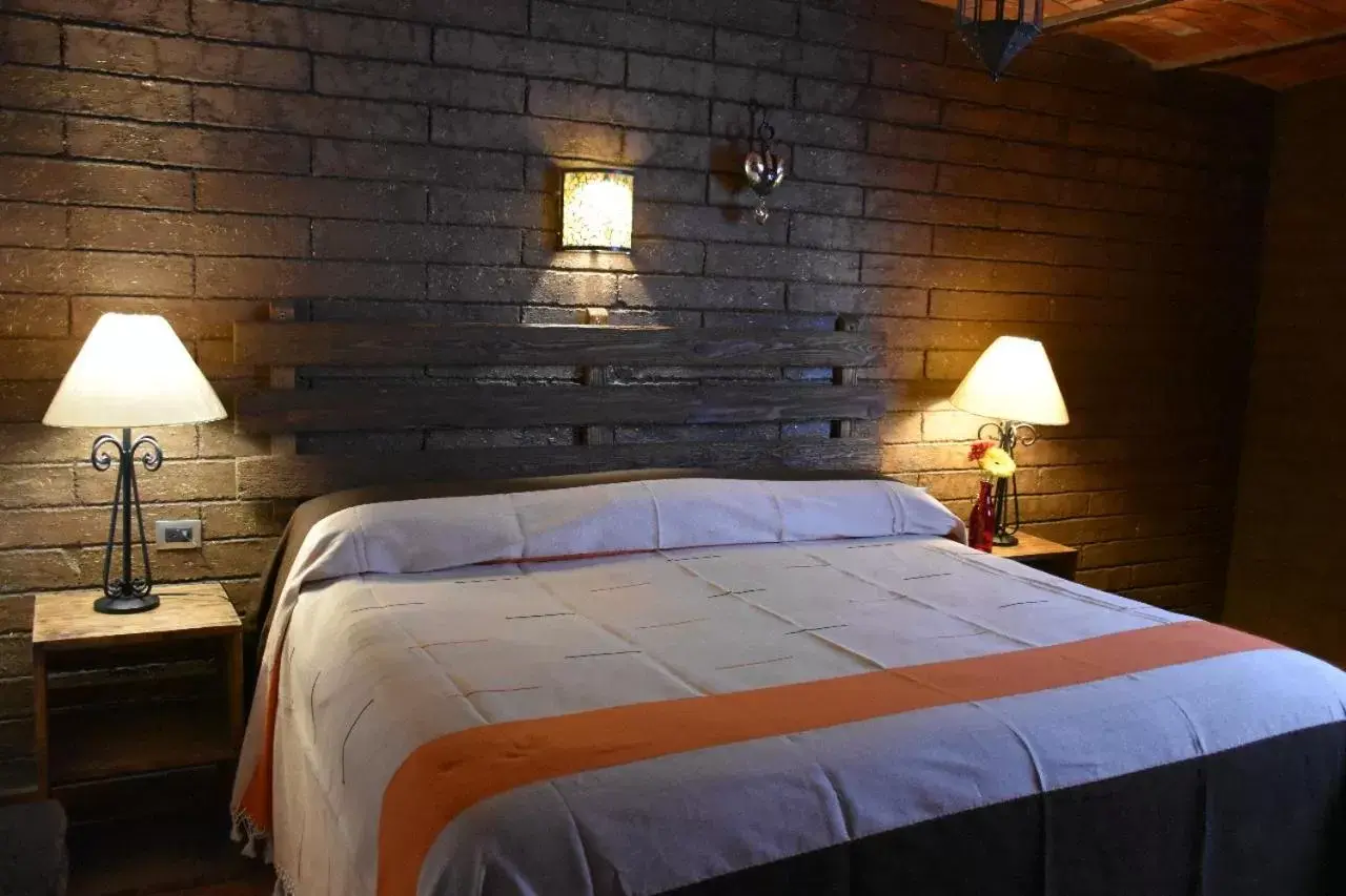 Bed in Hotel Mi Pueblito by Rotamundos