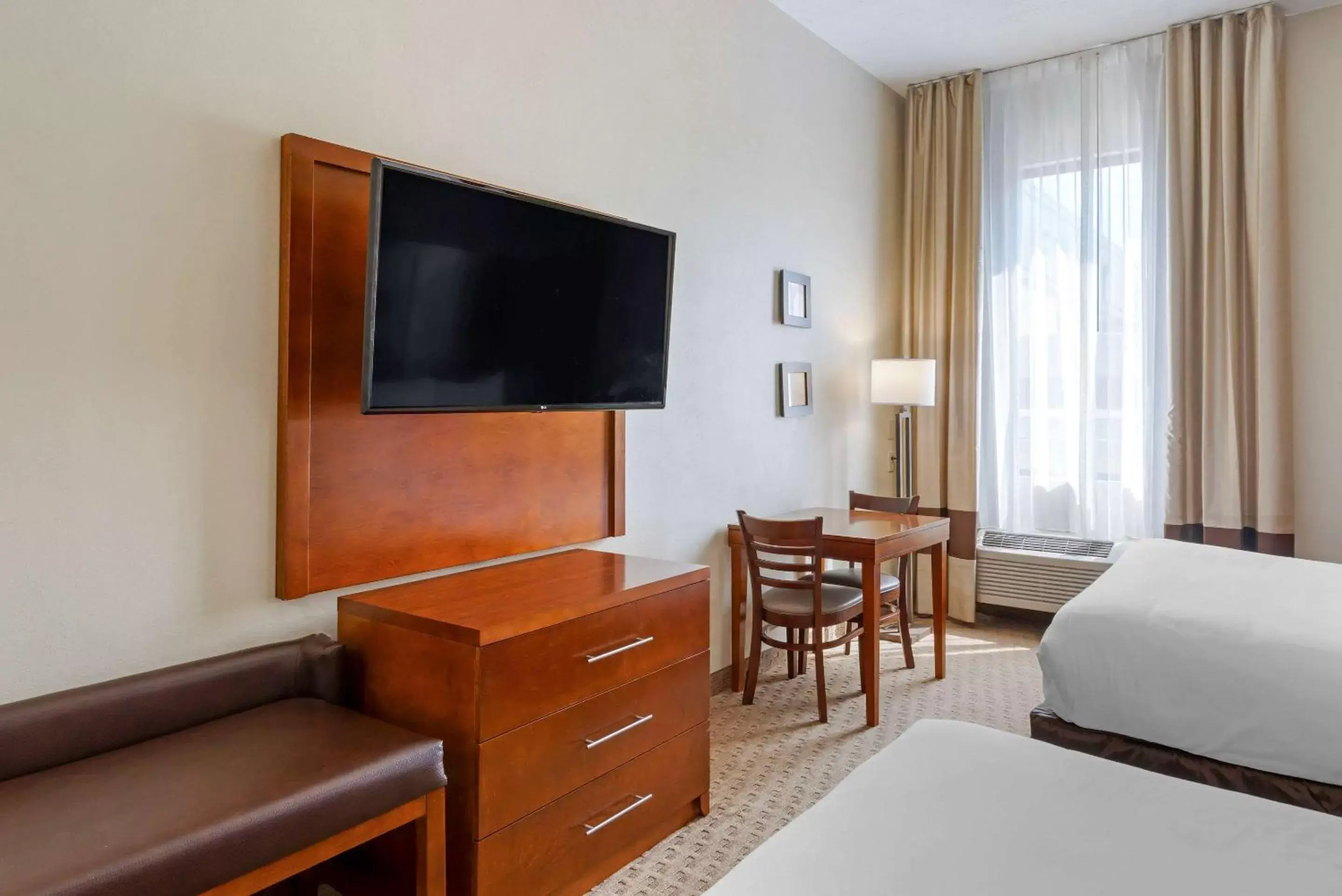 Photo of the whole room, TV/Entertainment Center in Comfort Inn Columbus Near Fort Moore