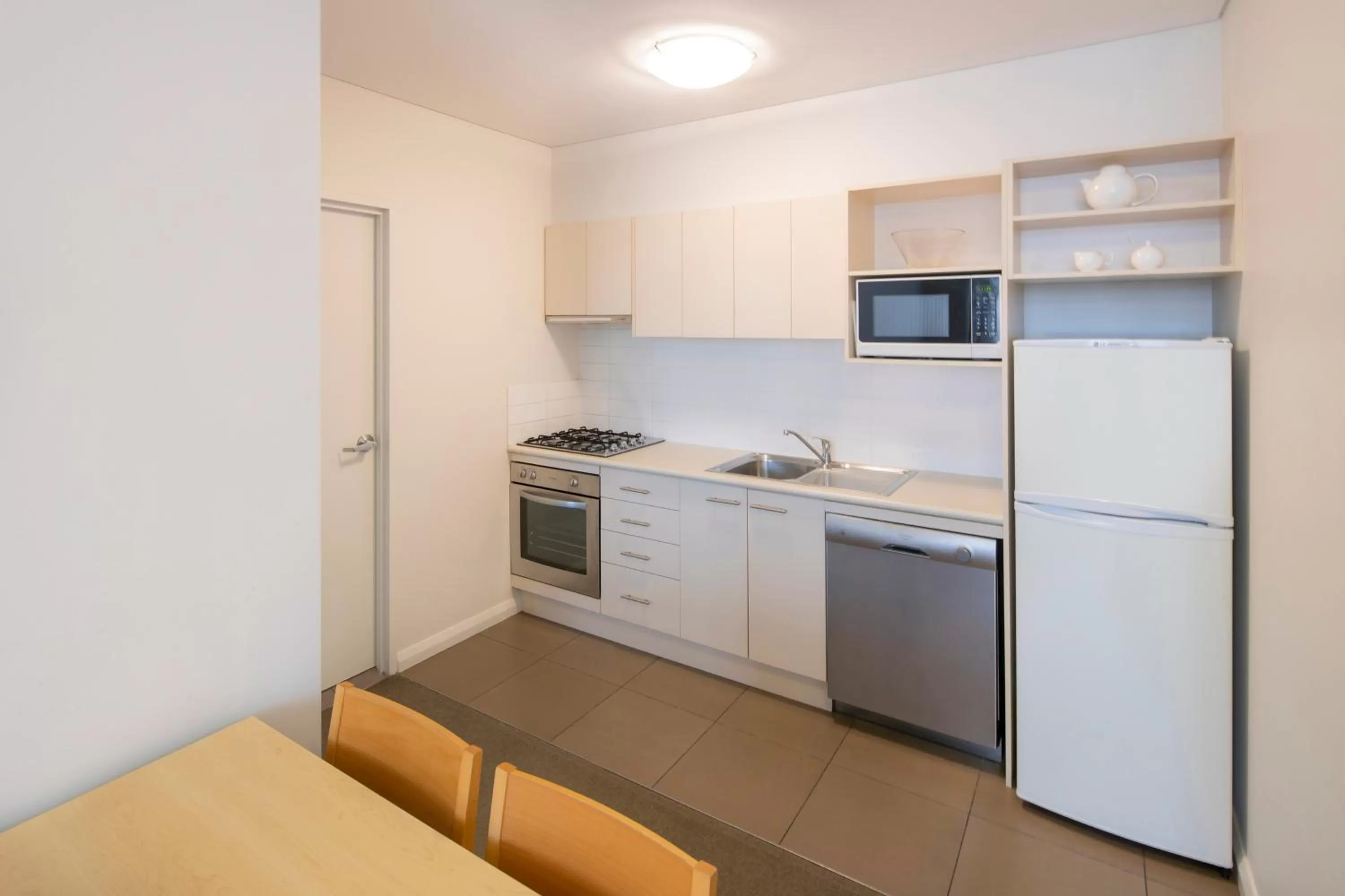 Kitchen or kitchenette in Mantra Castle Hill Sydney, an Accor Hotel