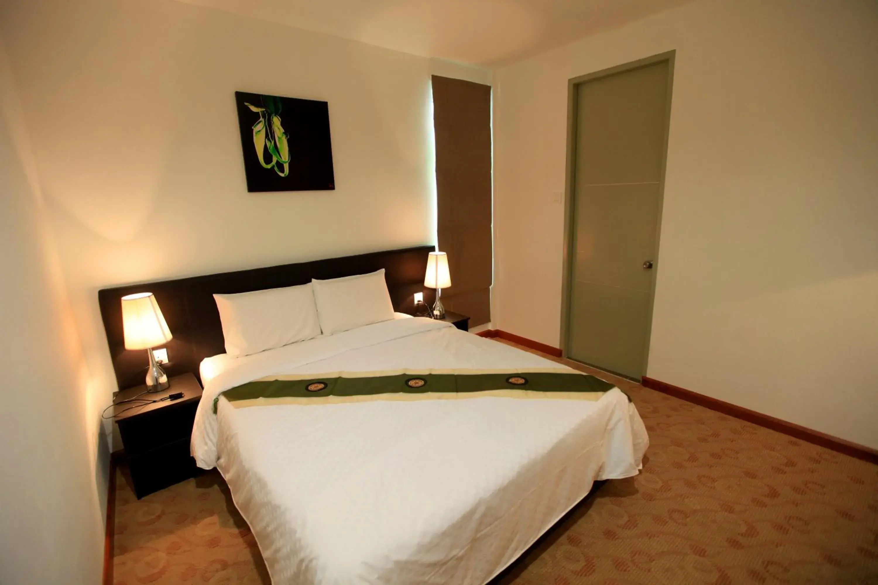 Bed in Merdeka Suites Hotel