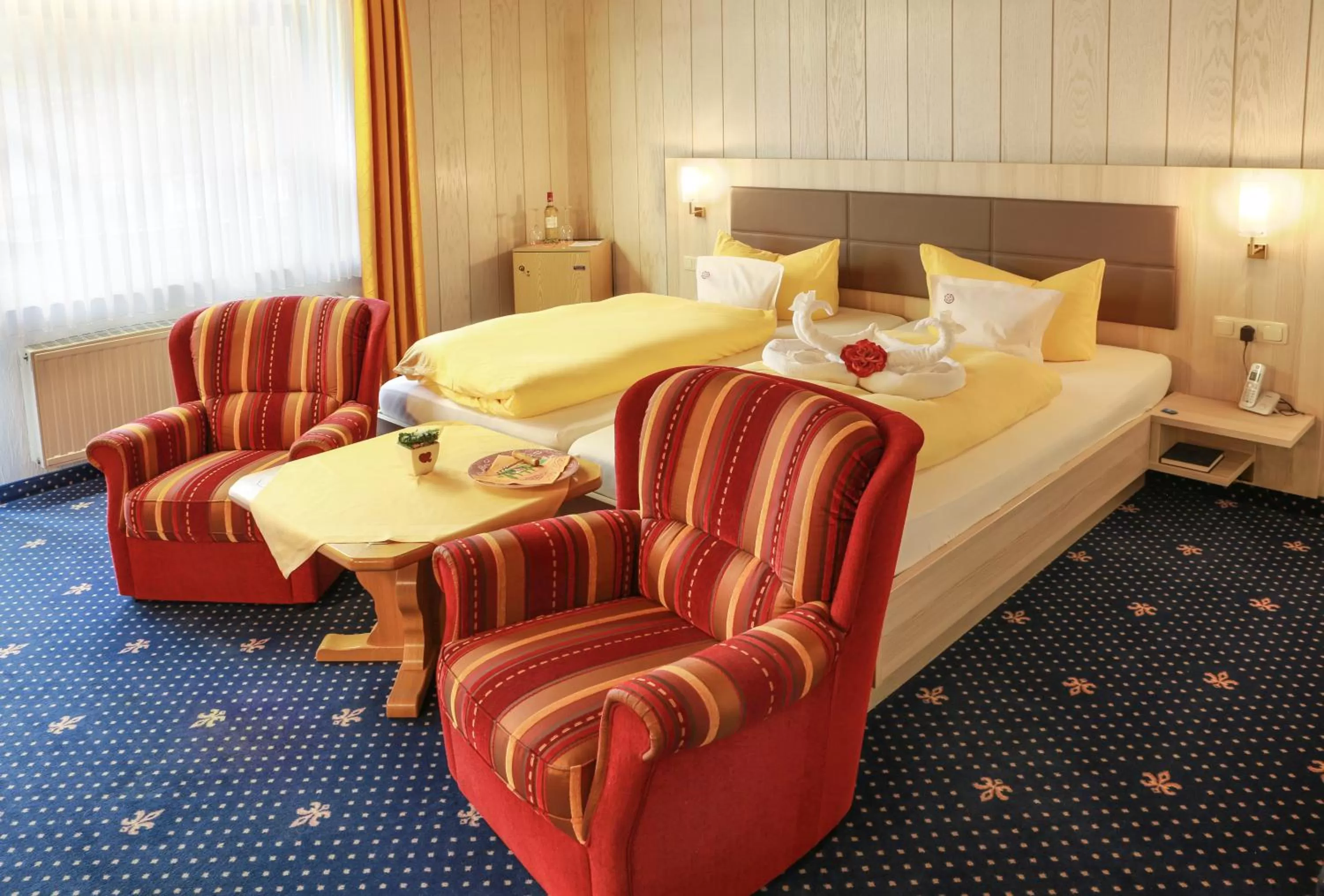 Living room, Bed in Sporthotel Göbel Garni