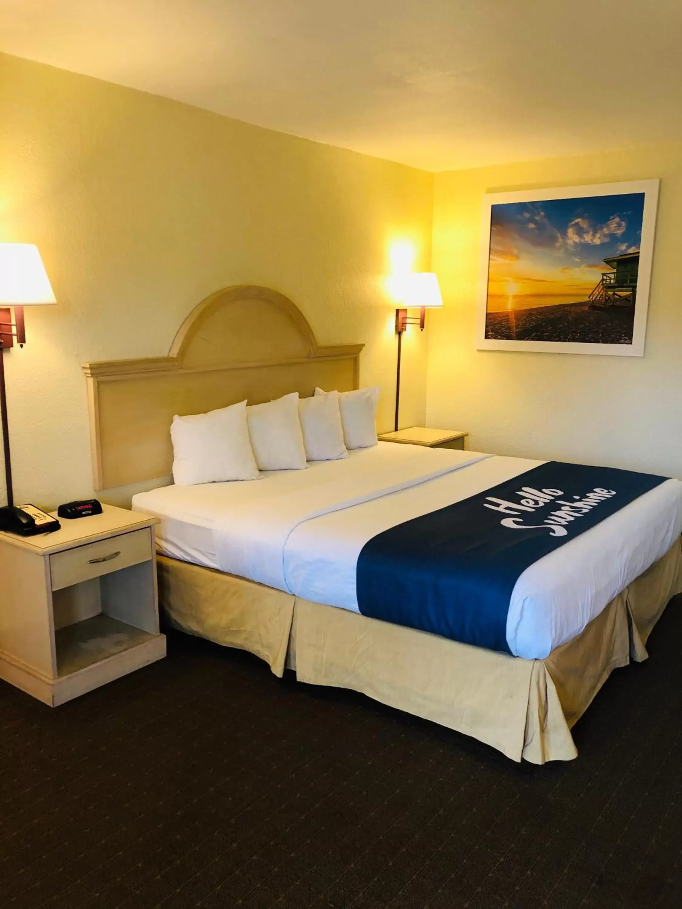 Bed in Days Inn & Suites by Wyndham Navarre Conference Center