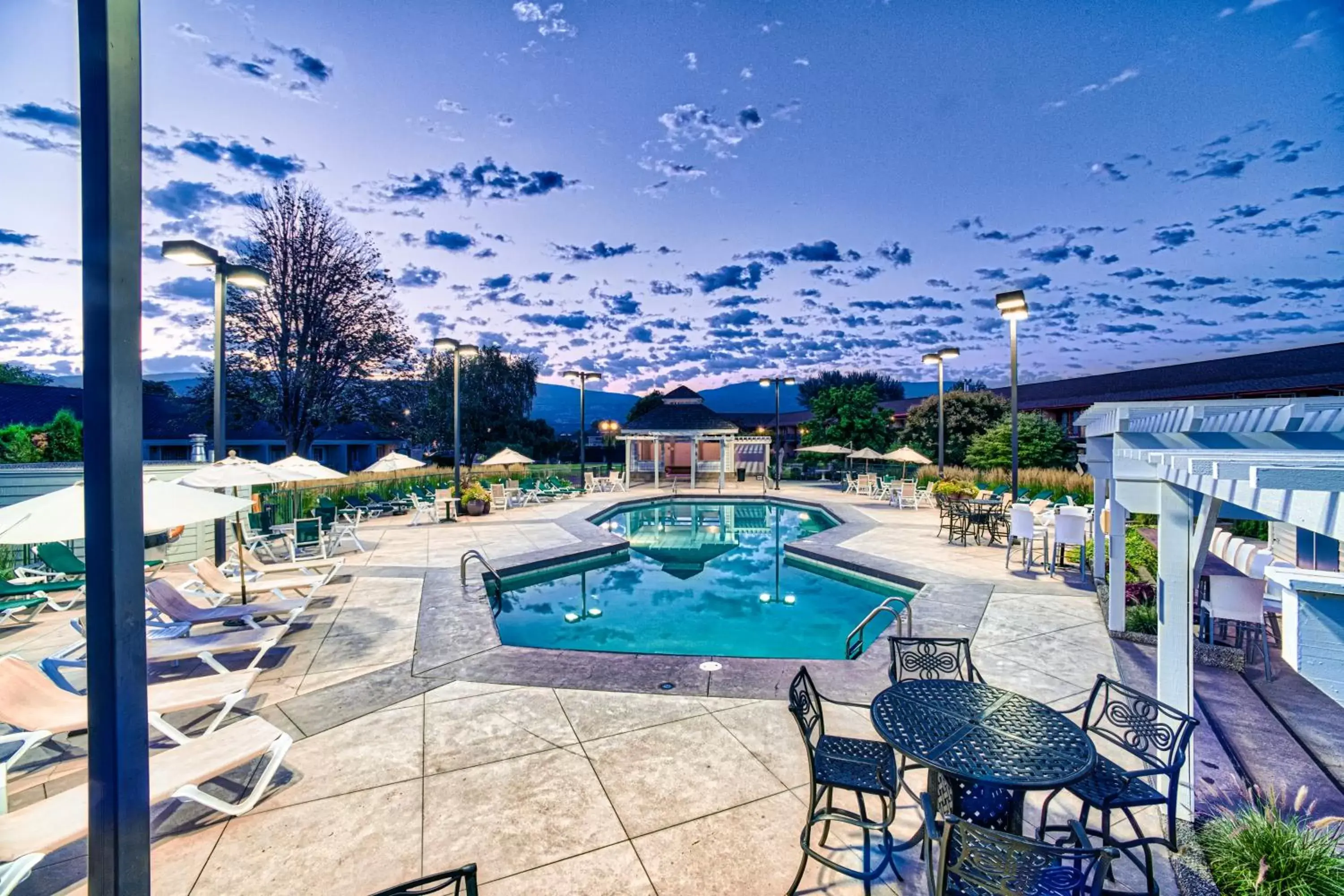 Balcony/Terrace, Swimming Pool in Ramada by Wyndham Penticton Hotel & Suites