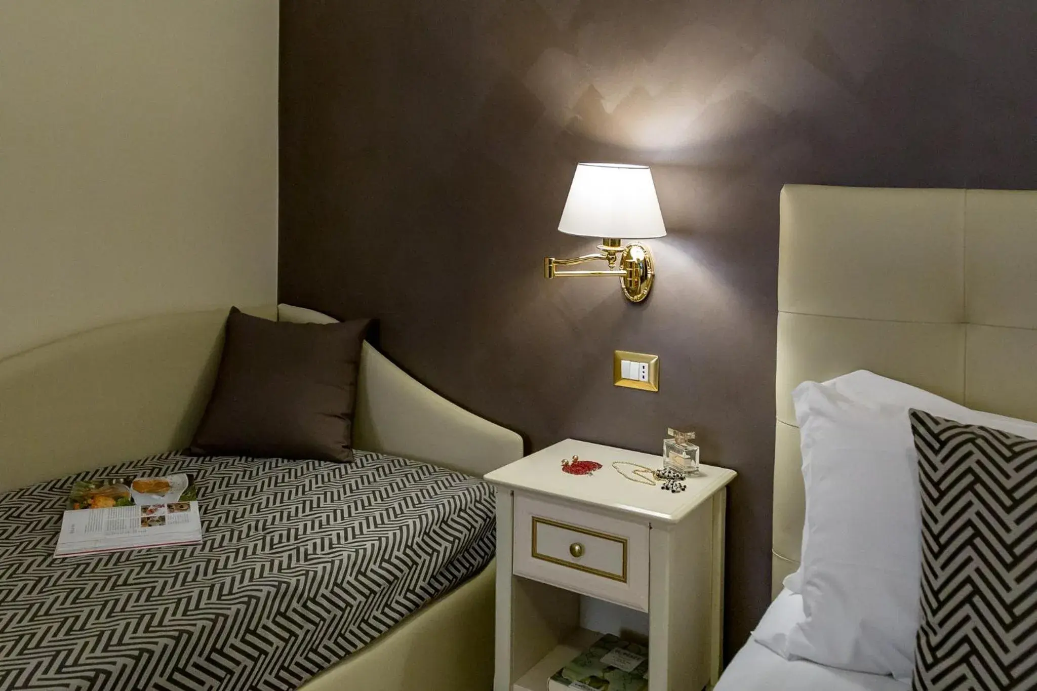 Bed in Vittorio Emanuele Boutique Hotel