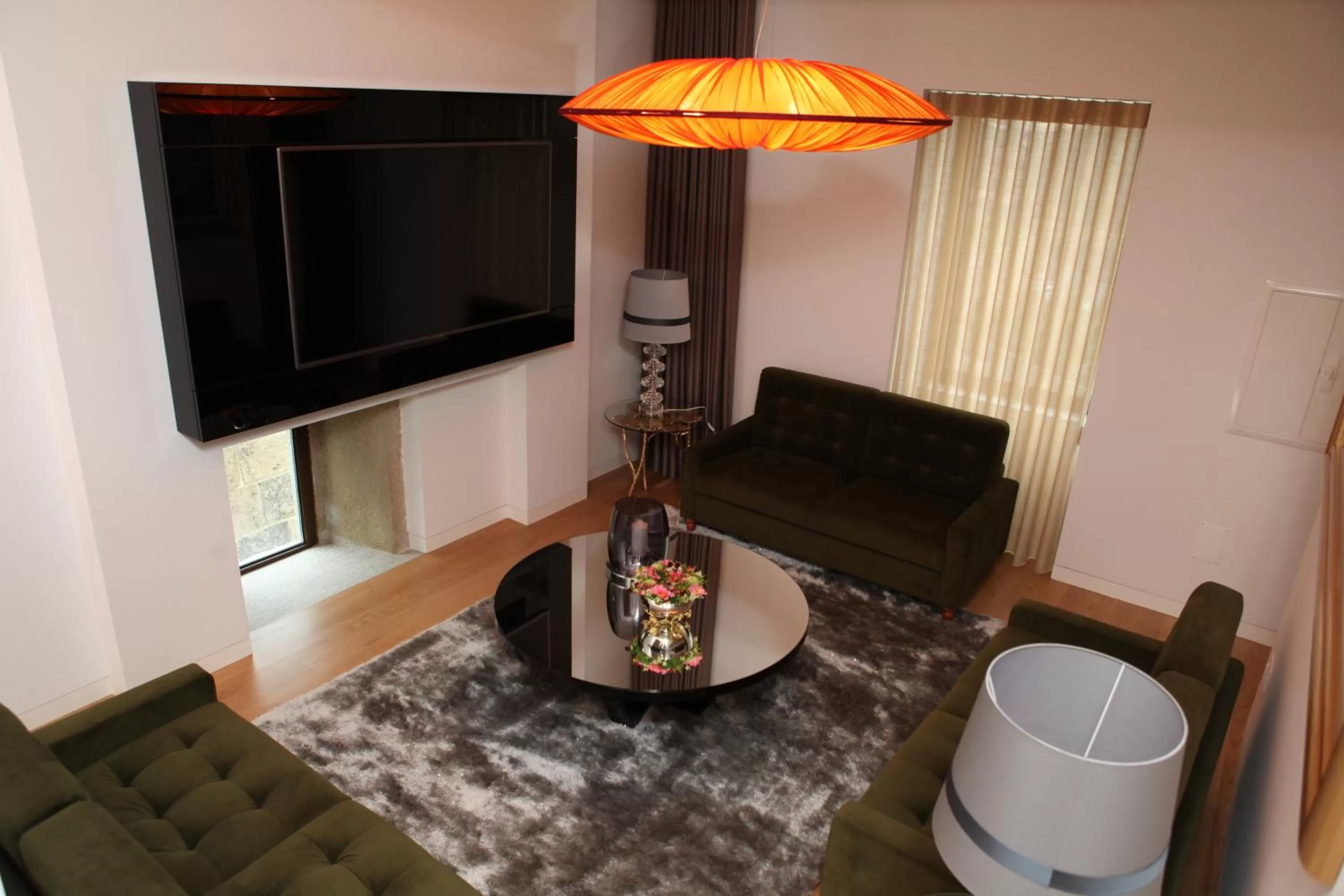 Communal lounge/ TV room in Hotel Rural Quinta das Quintães