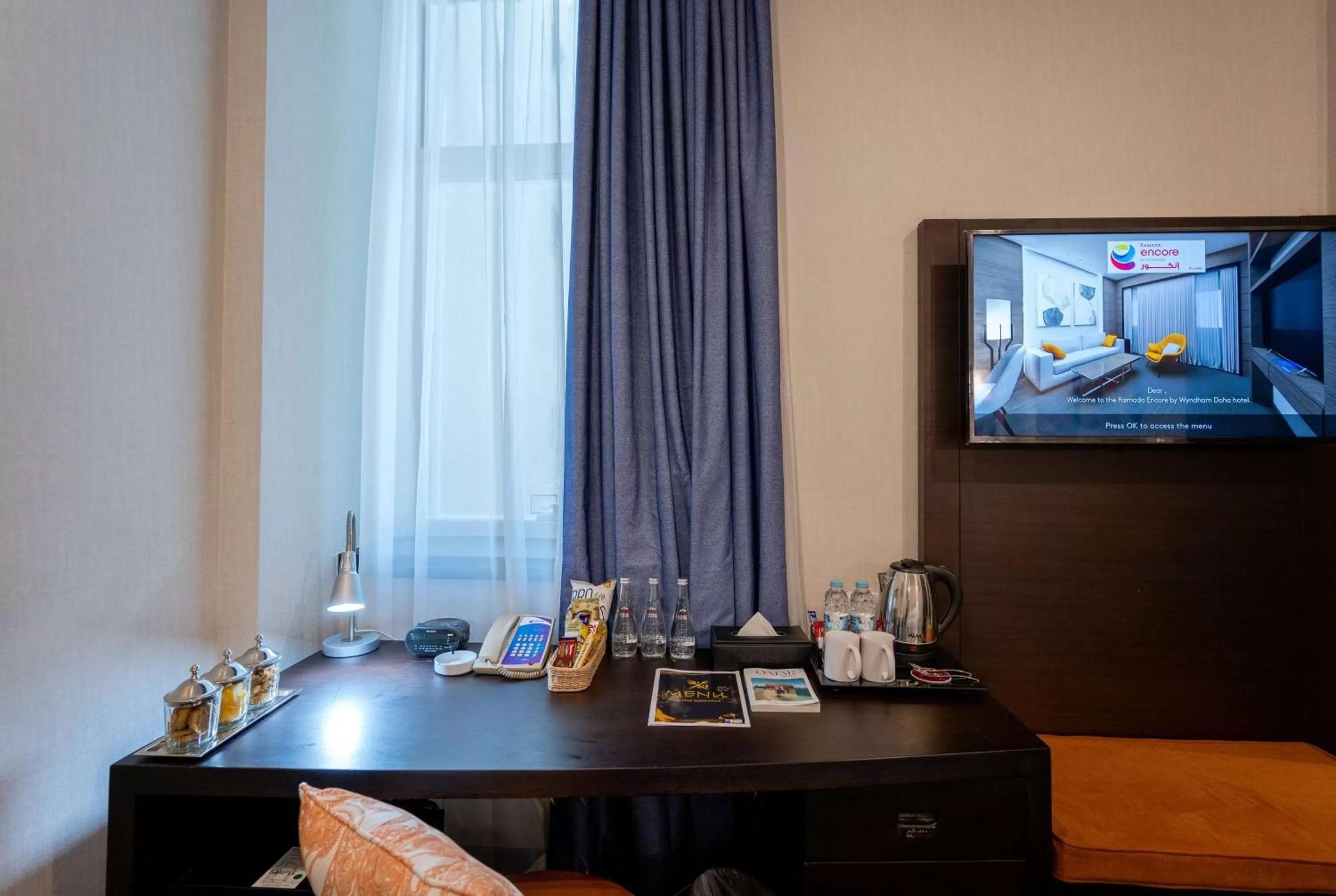 Photo of the whole room, Bed in Ramada Encore Doha by Wyndham