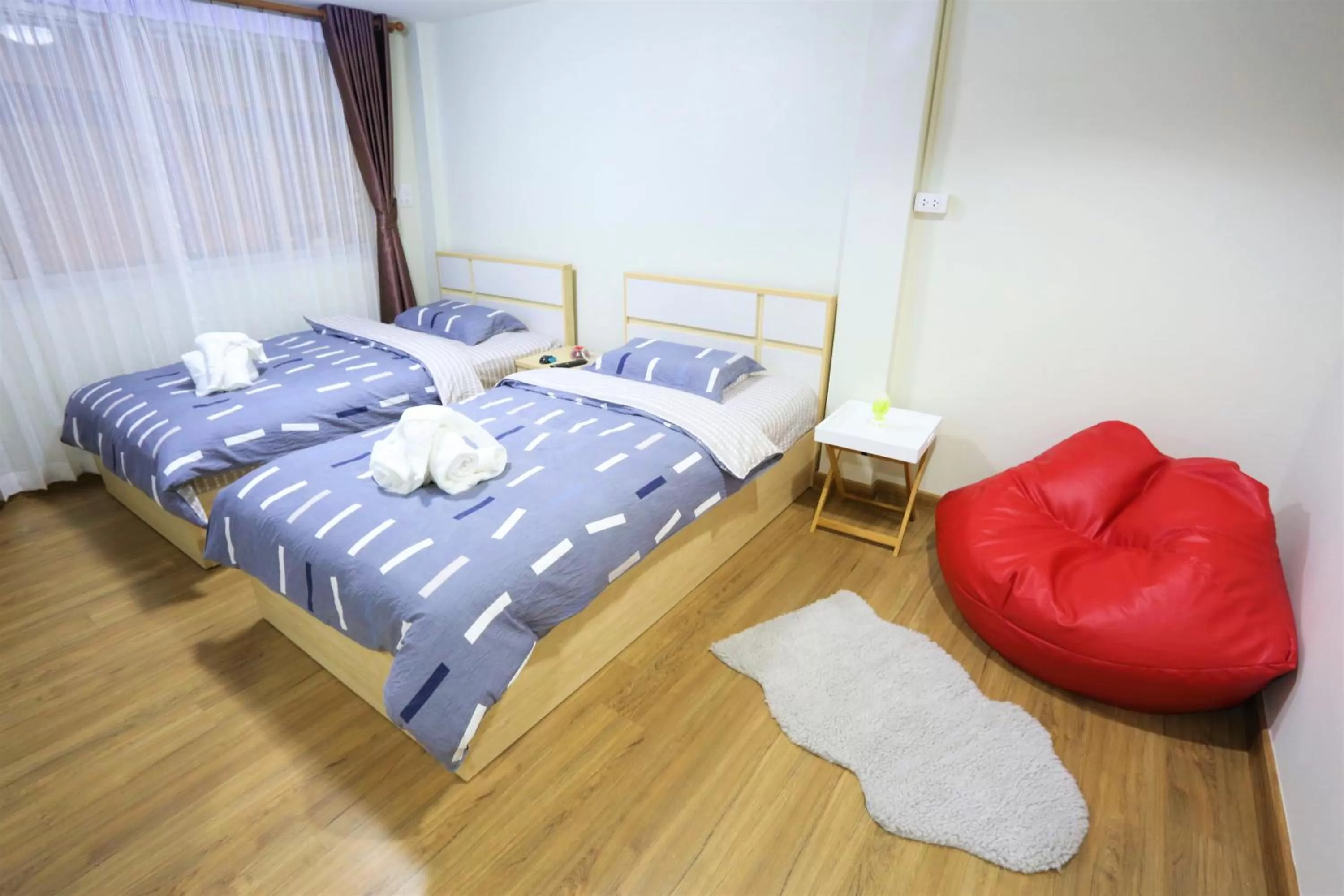 Photo of the whole room, Bed in TD Bangkok