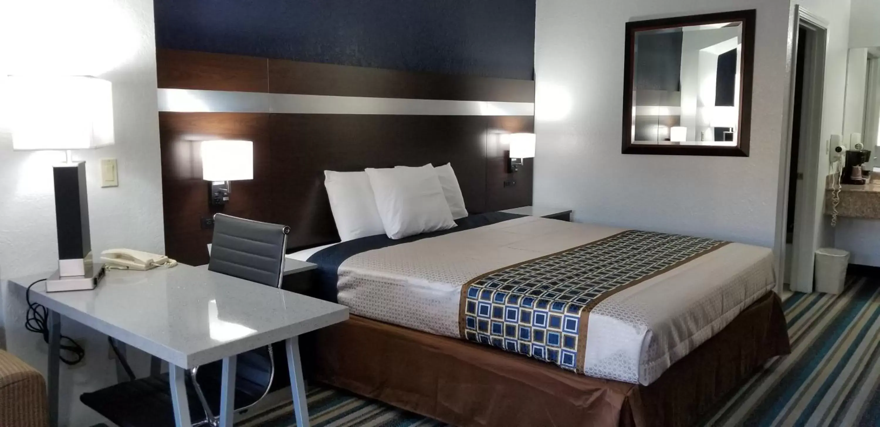 Bed in HomeBridge Inn and Suites