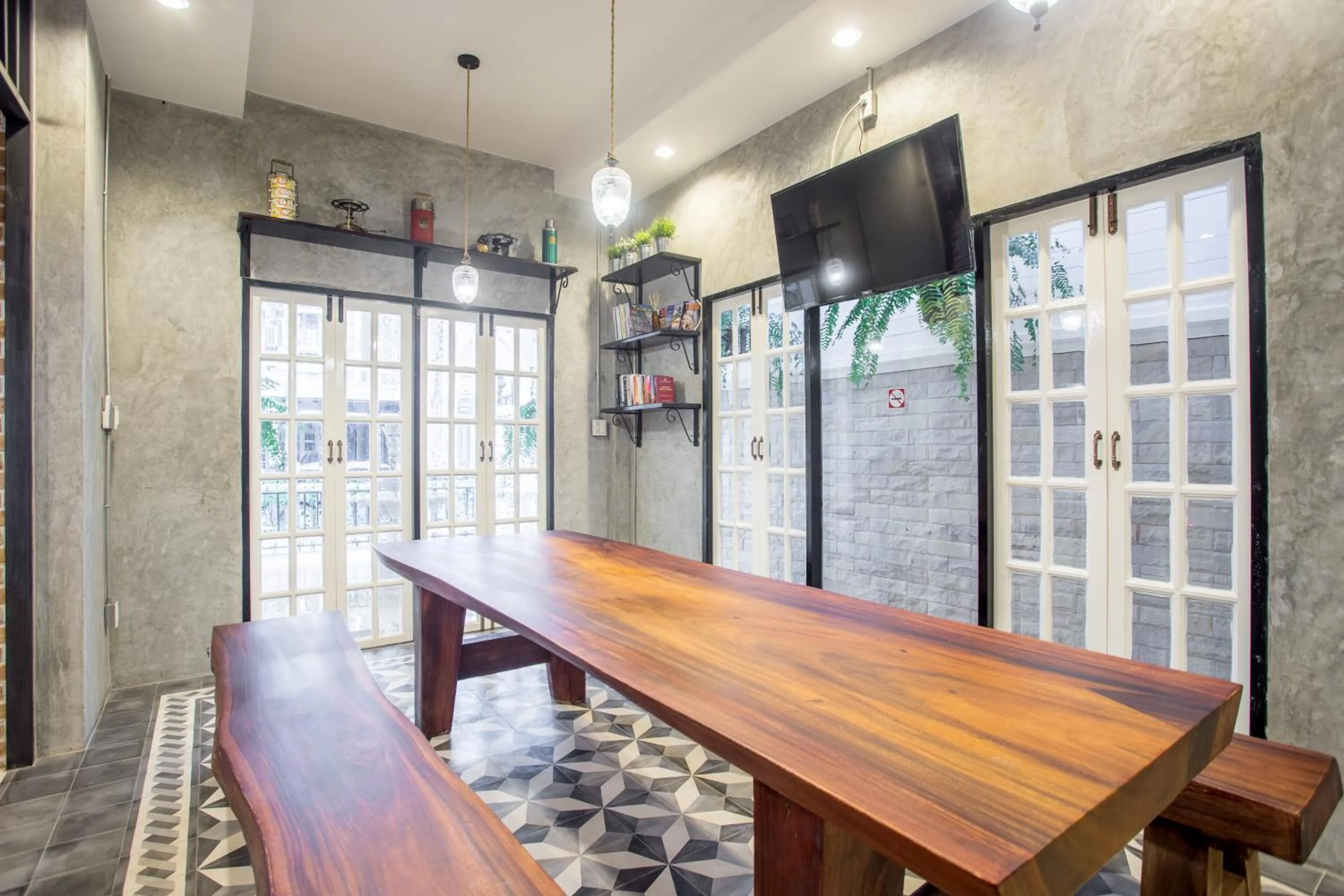 Communal lounge/ TV room in X9Hostel