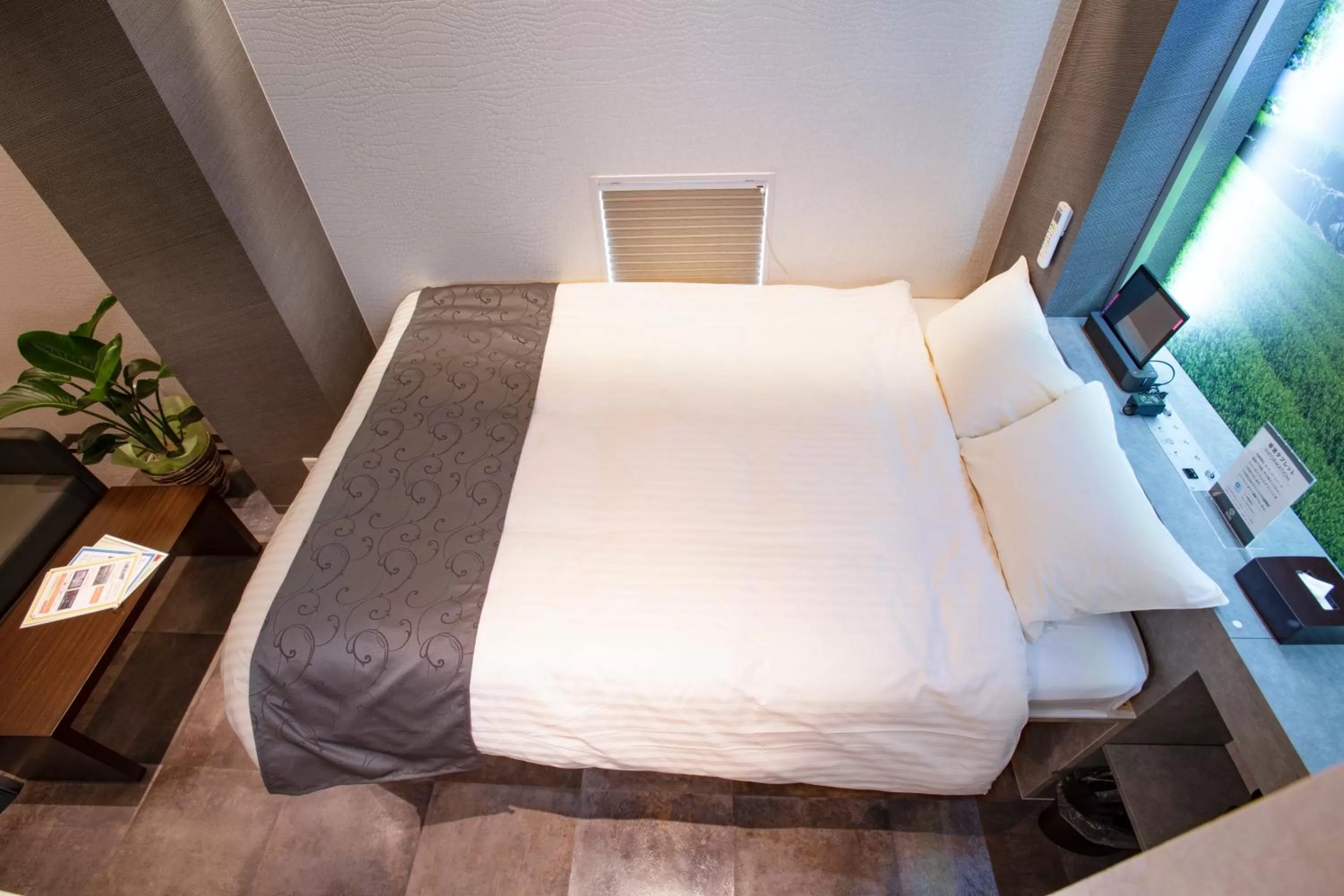 Bed in Hotel Xcell Hiroshima Nagarekawa