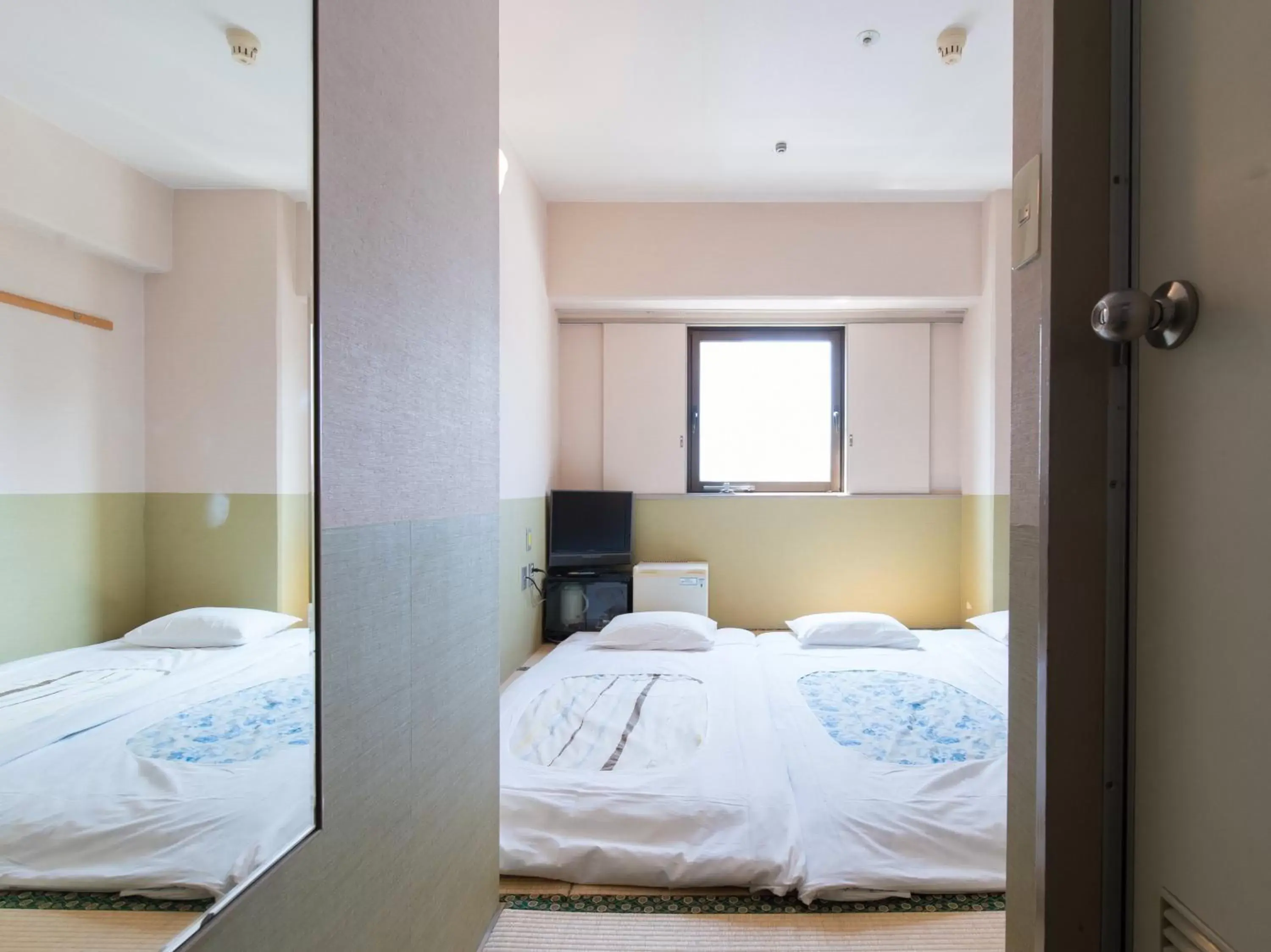 Bed in Tabist Hotel Tetora Kitakyushu