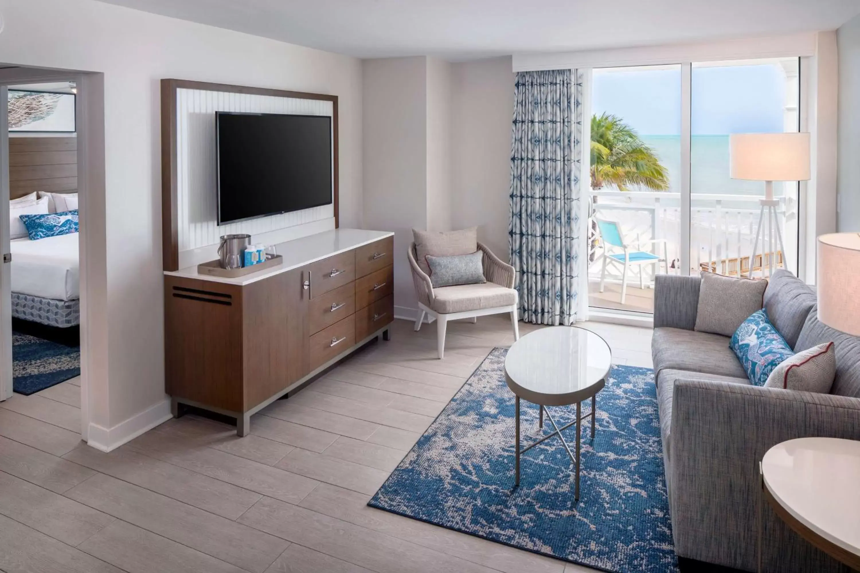 Living room, TV/Entertainment Center in The Reach Key West, Curio Collection by Hilton