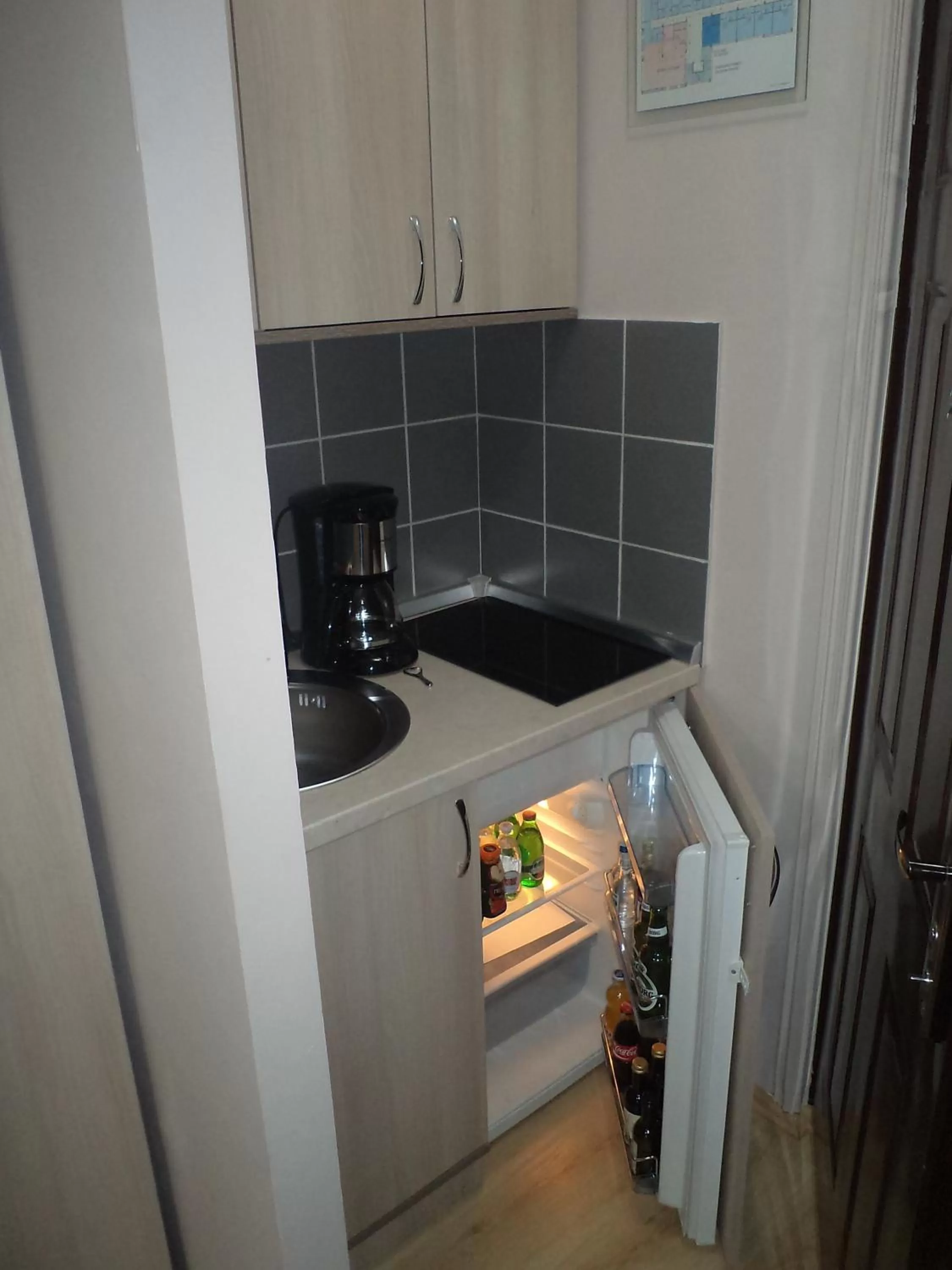 Kitchen or kitchenette in Garni Hotel Tri O