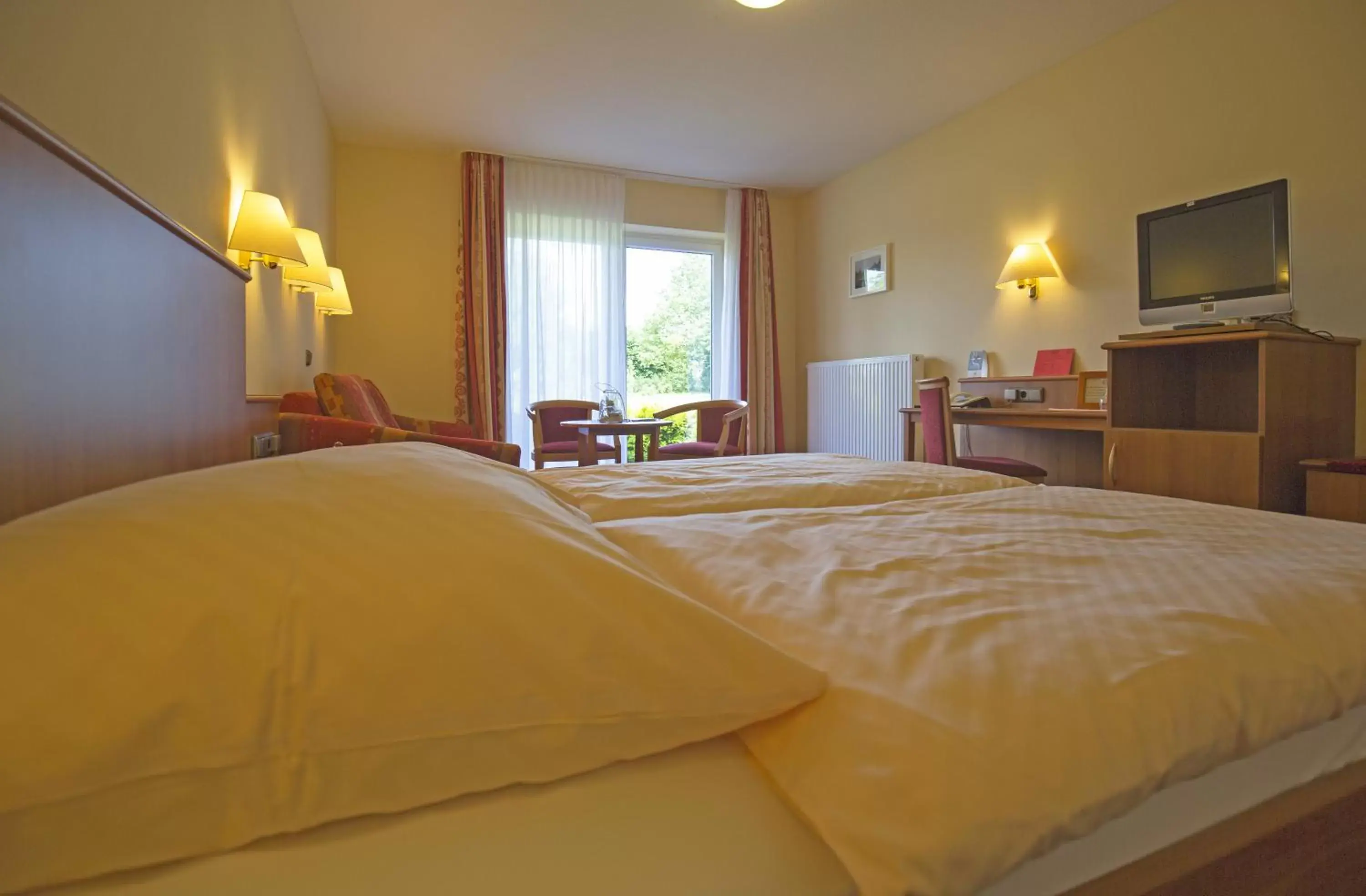 Photo of the whole room, Bed in Hotel Wittensee Schützenhof
