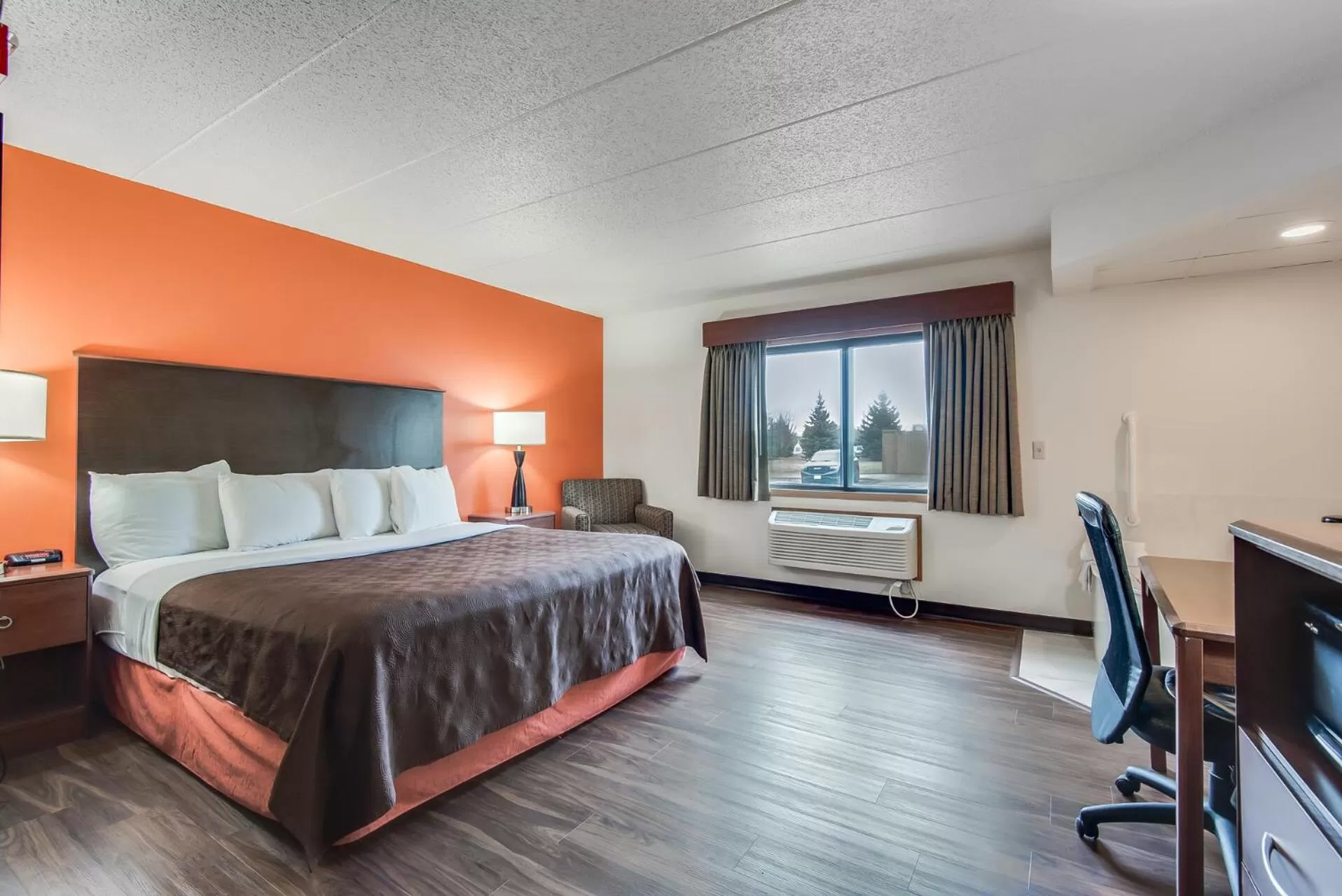 Bed in AmericInn by Wyndham Coon Rapids