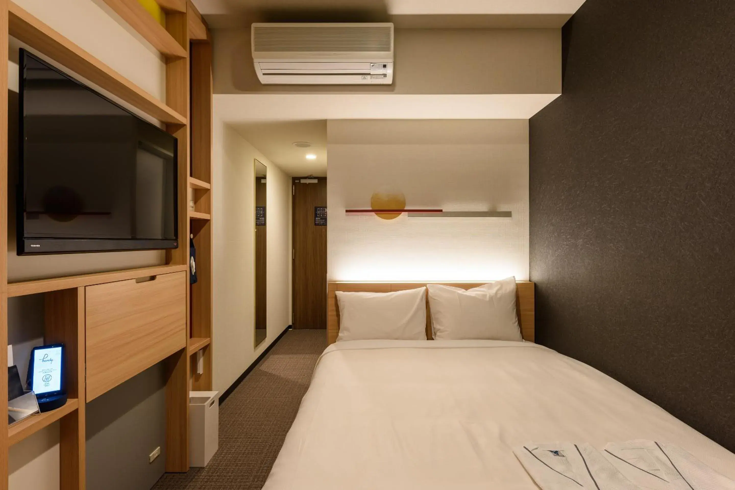 Bed in hotel MONday Tokyo Nishikasai