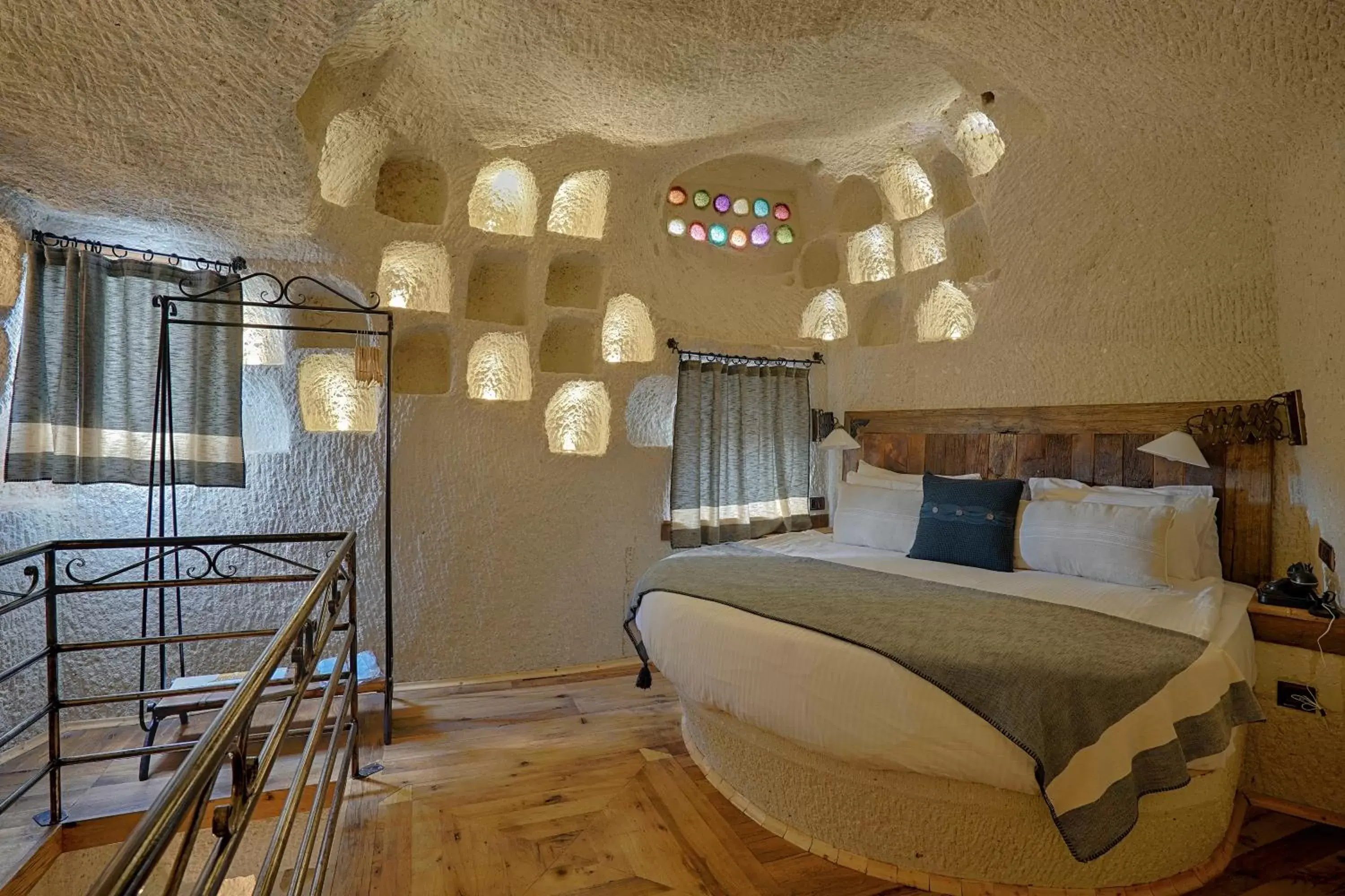 Bed in Artemis Cave Suites & Spa- Adults Only