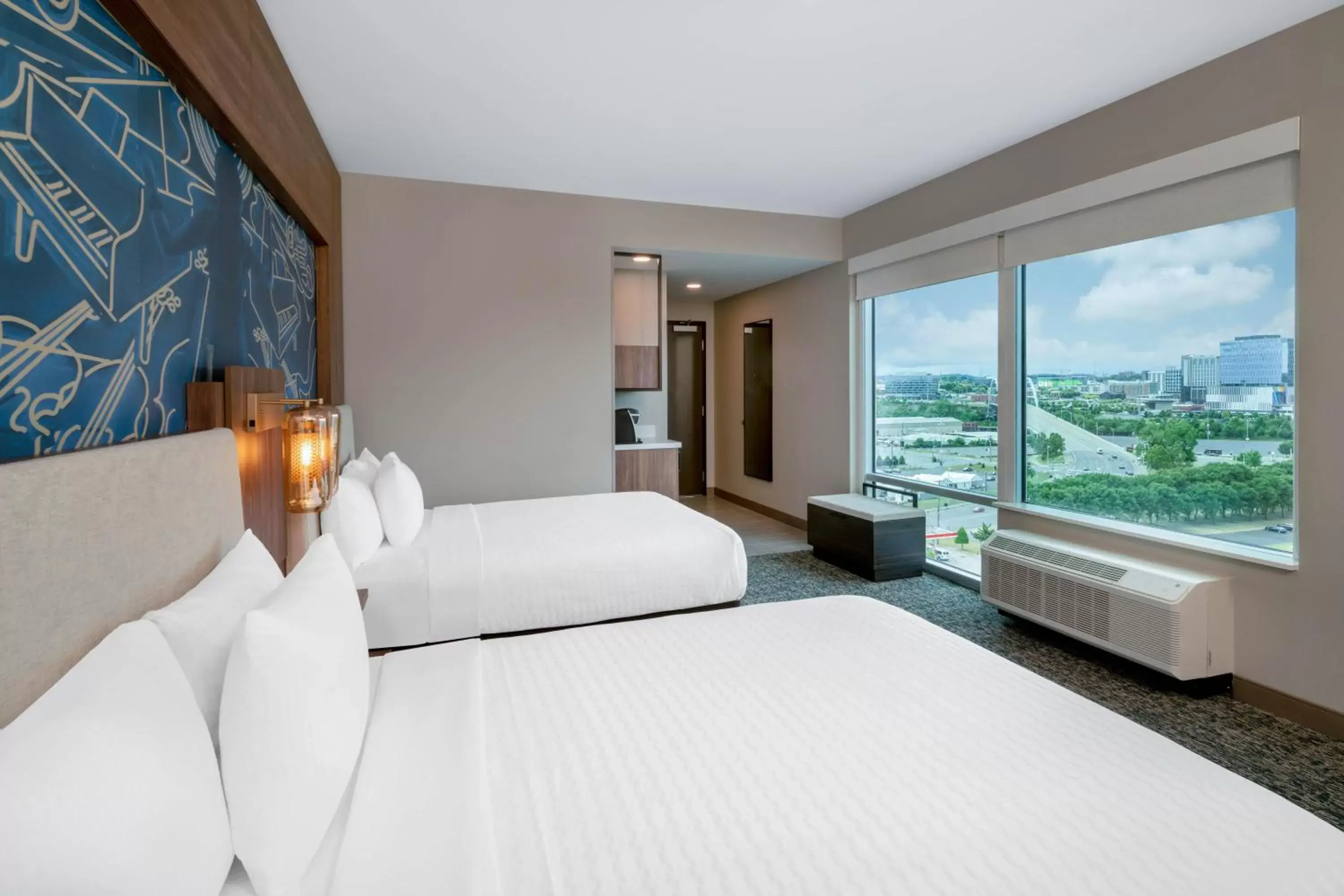 Bed in La Quinta Inn & Suites by Wyndham Nashville Downtown Stadium