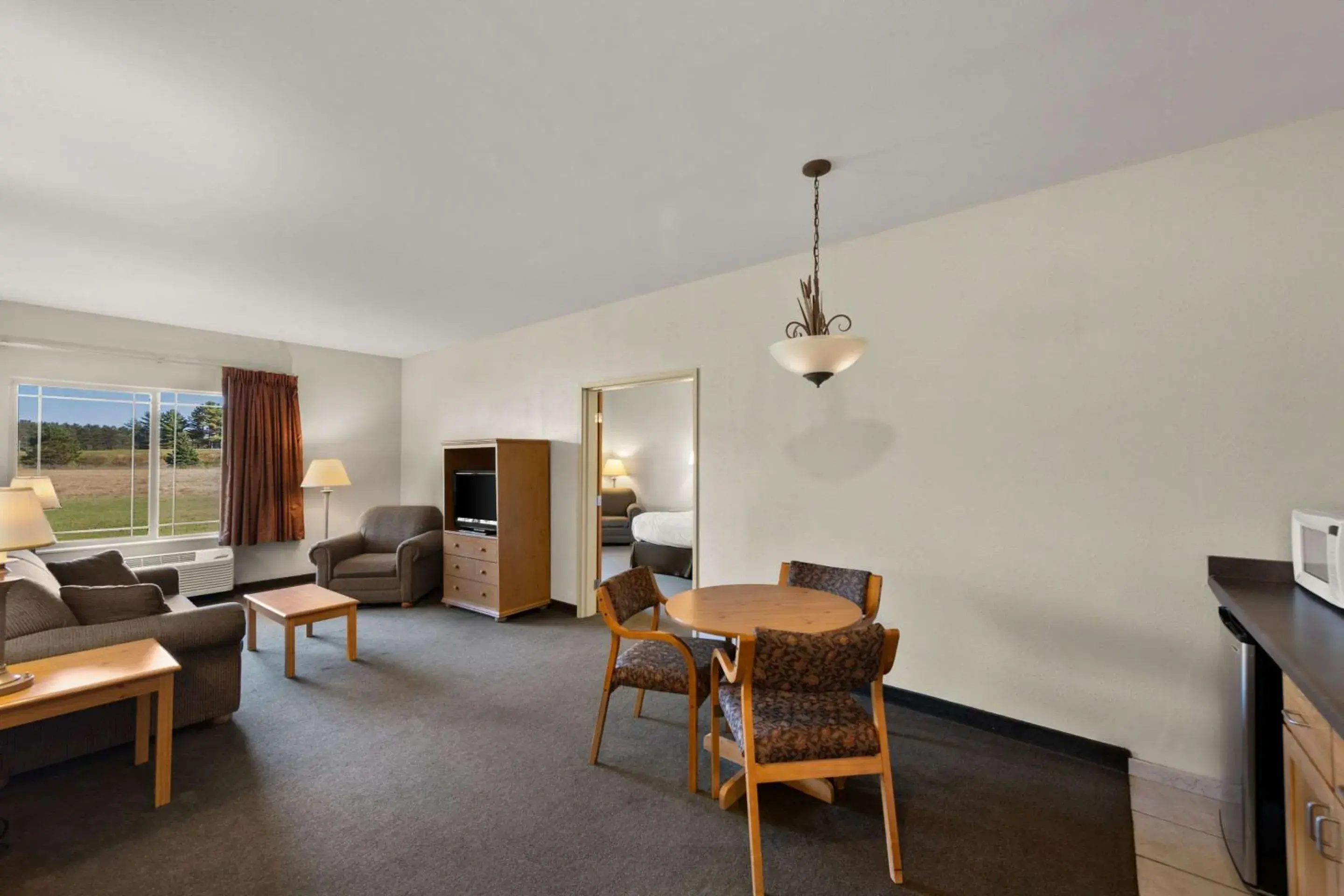 Bedroom, Seating Area in Rodeway Inn & Suites