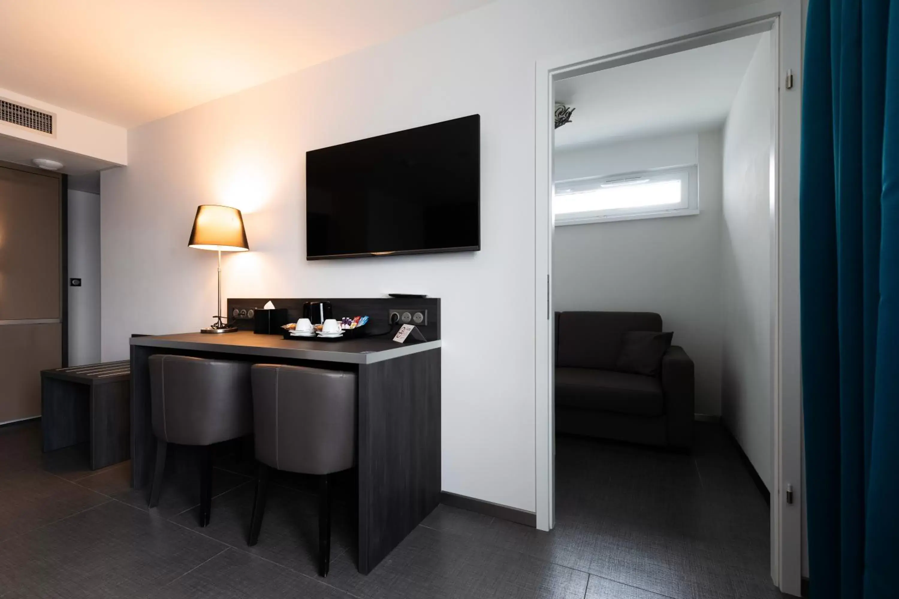 TV and multimedia, TV/Entertainment Center in Mercure Bale Mulhouse Aeroport