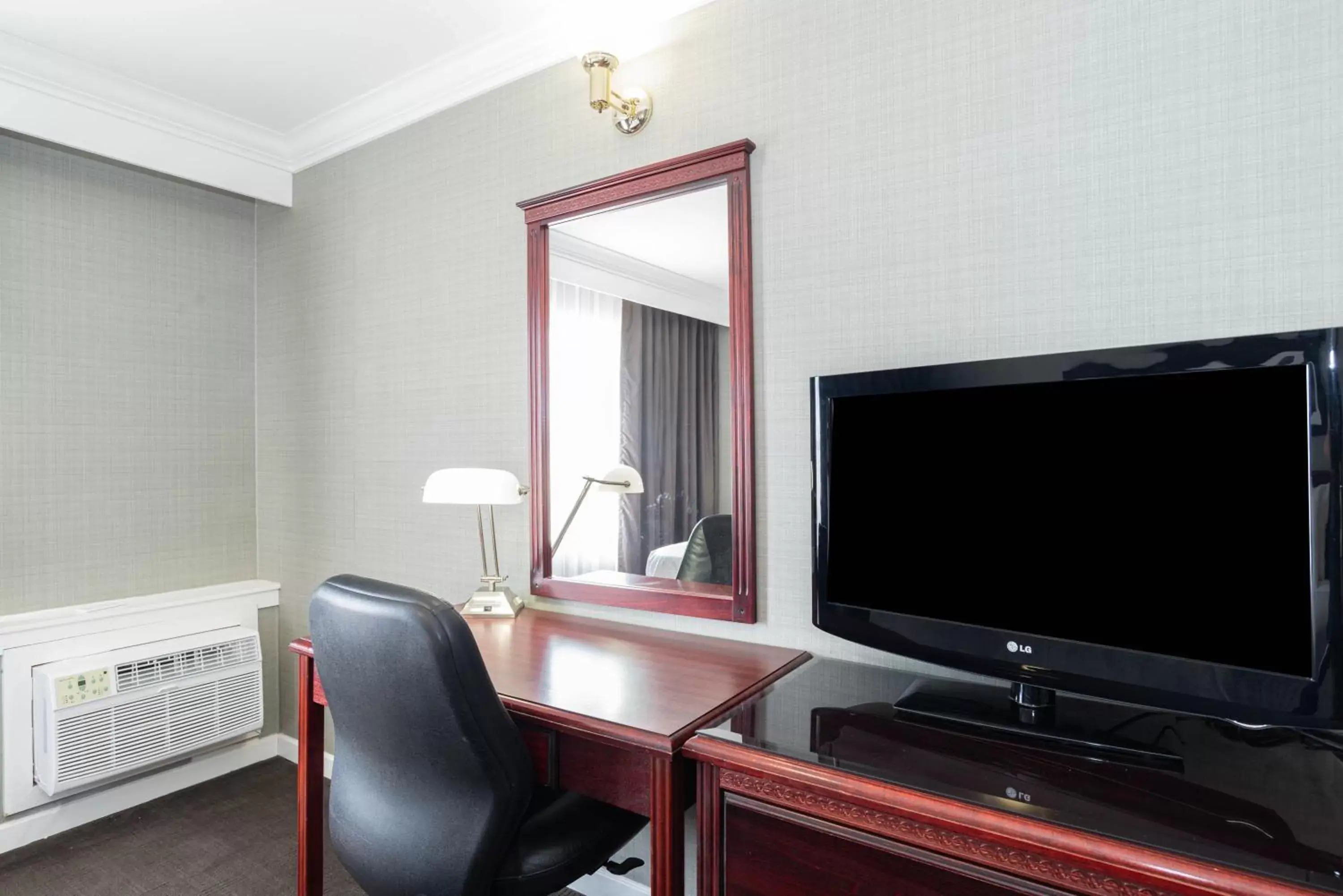 Photo of the whole room, TV/Entertainment Center in Sandman Hotel Red Deer