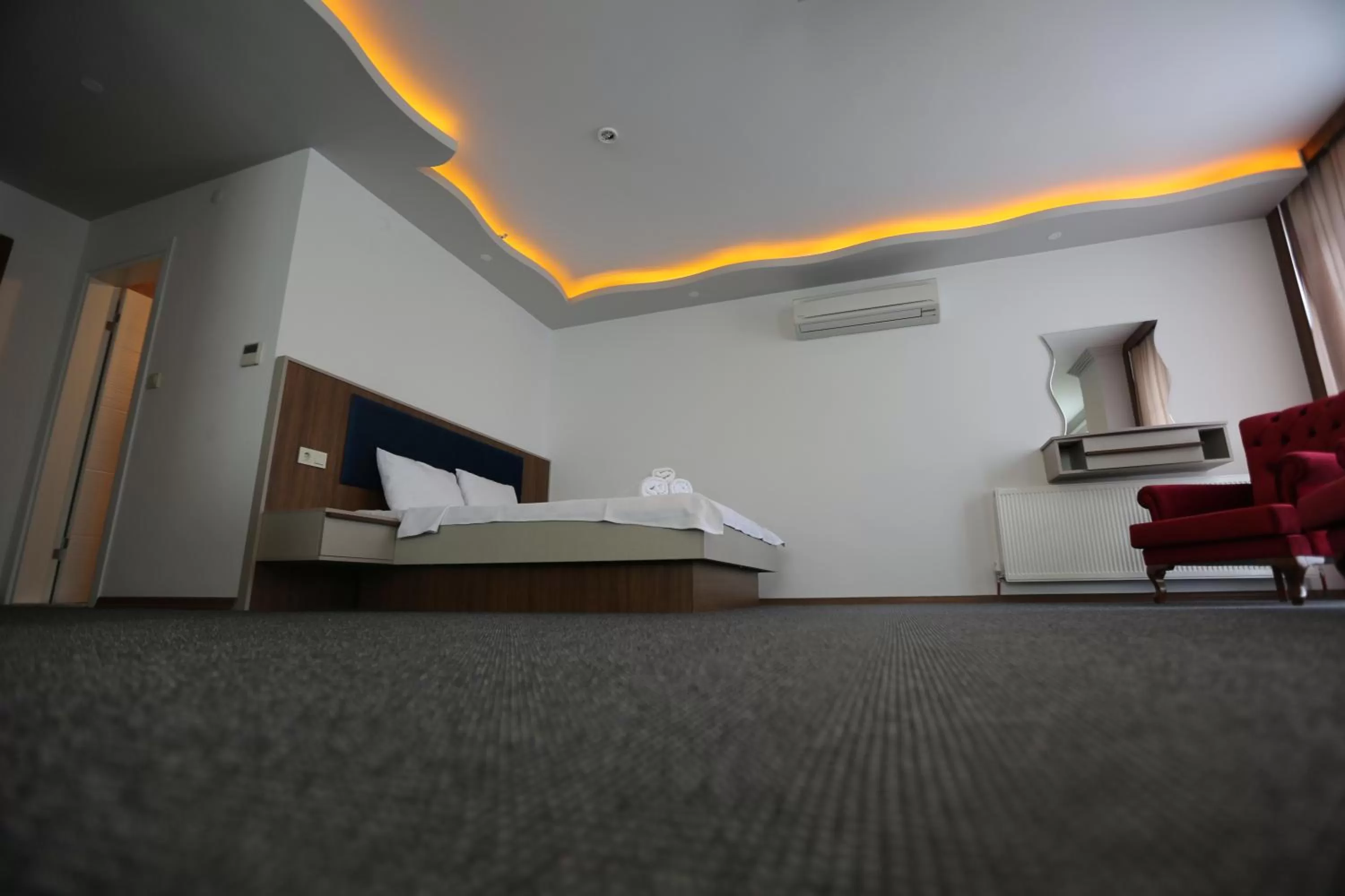 Bed in TEVETOGLU HOTEL