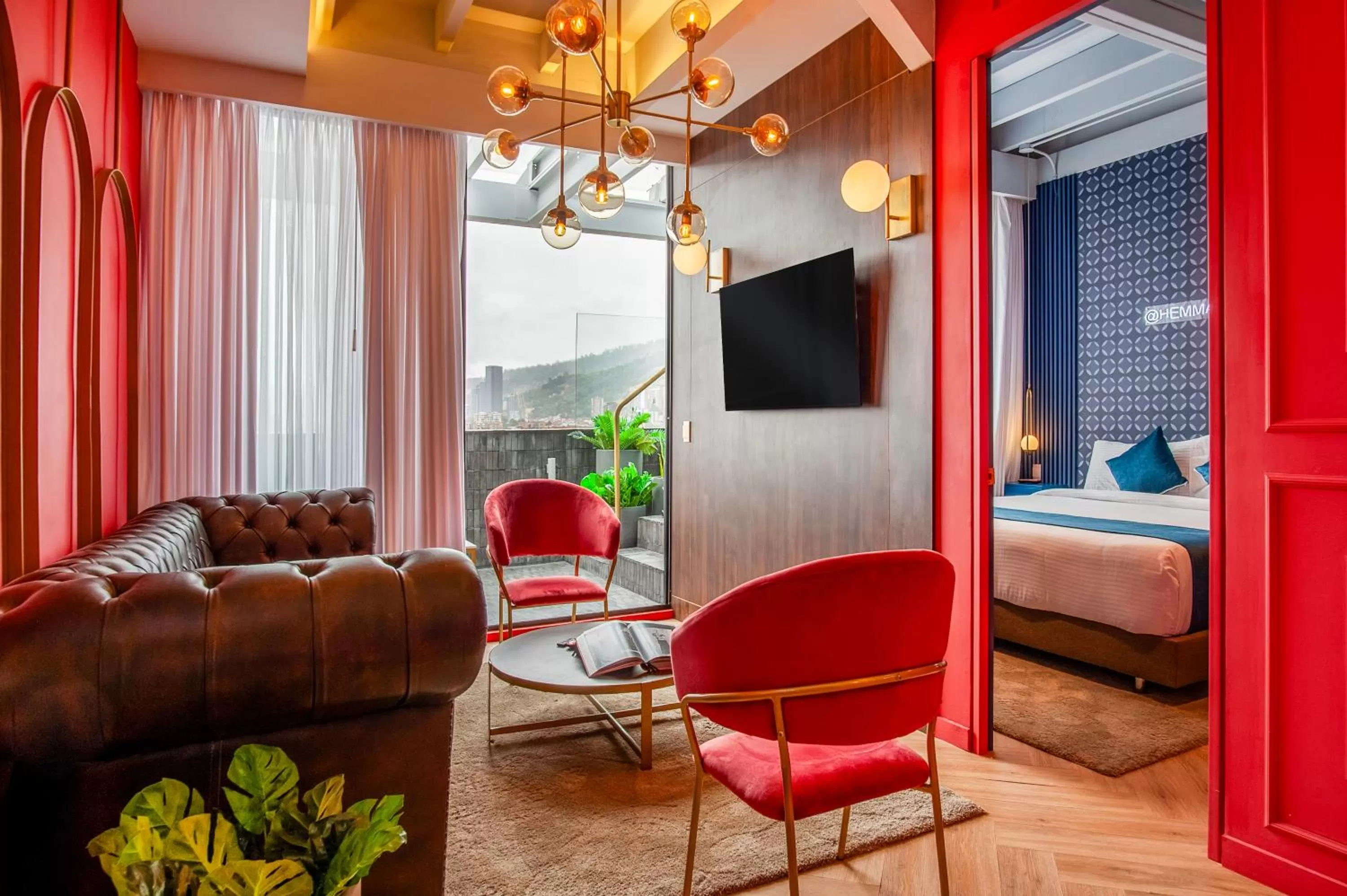 Living room, Bed in Hemma Bogotá Country Luxury Suites Hotel