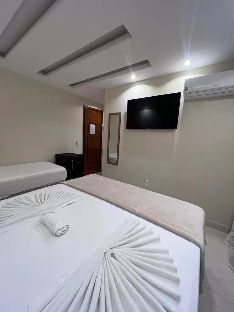 Bed in Pousada Arraial Tropical