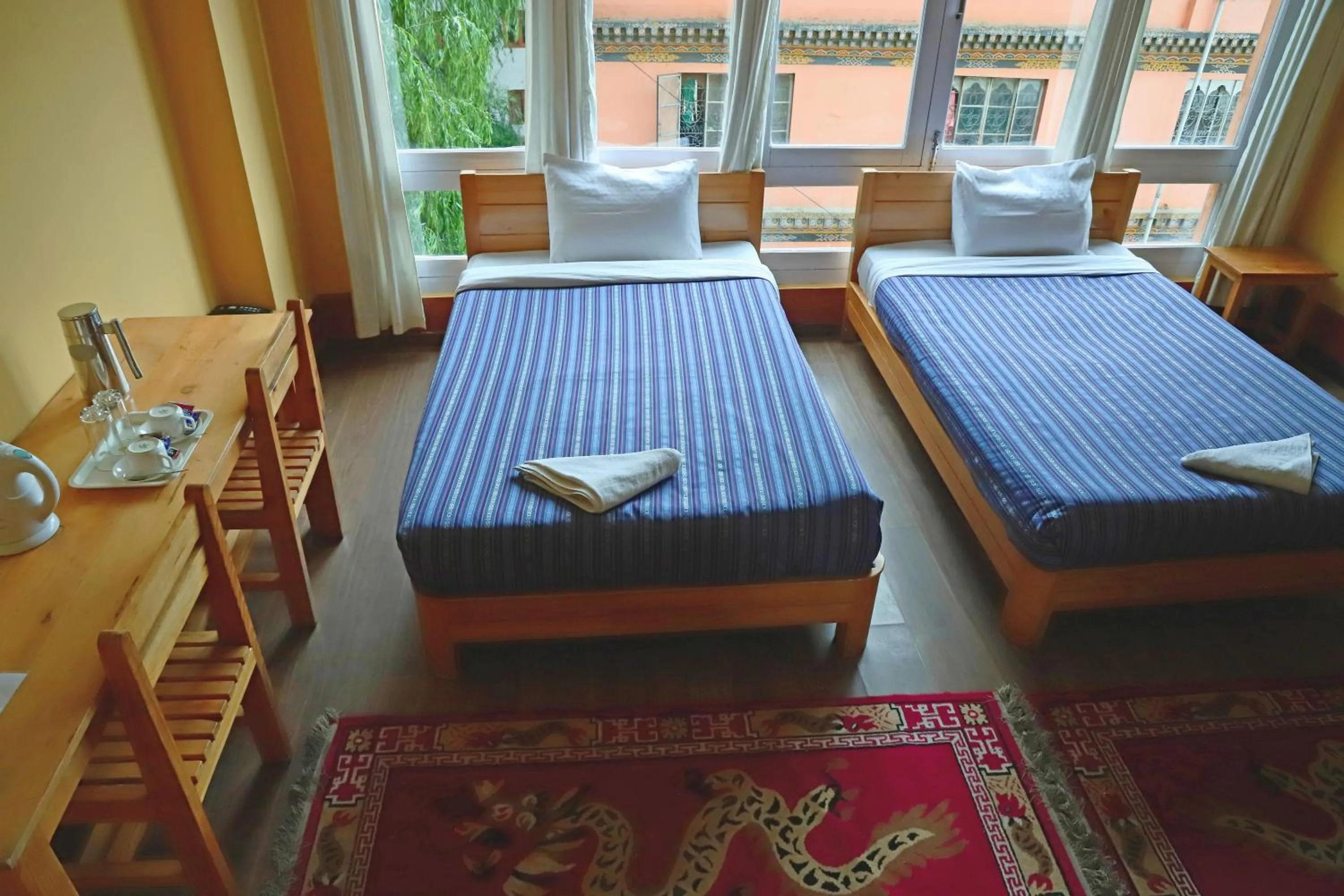 Bed, Seating Area in Hotel Thimphu City
