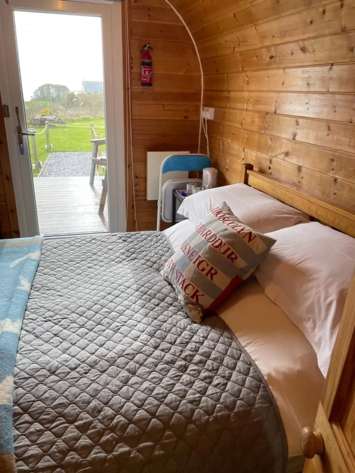 Bed in Sea and Mountain View Luxury Glamping Pods Heated