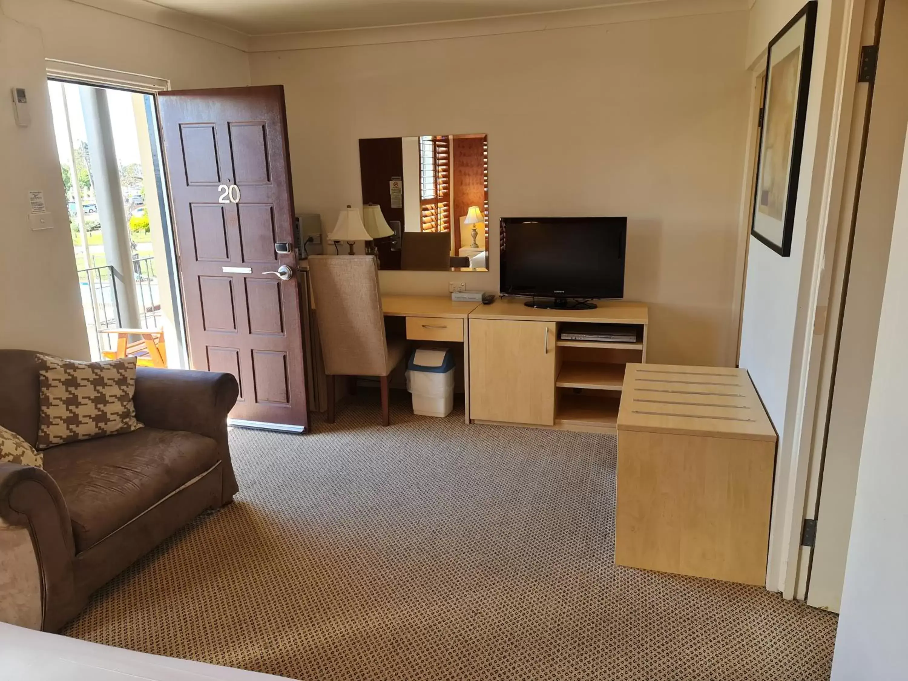 Communal lounge/ TV room, Seating Area in Country Plaza Motel Taree