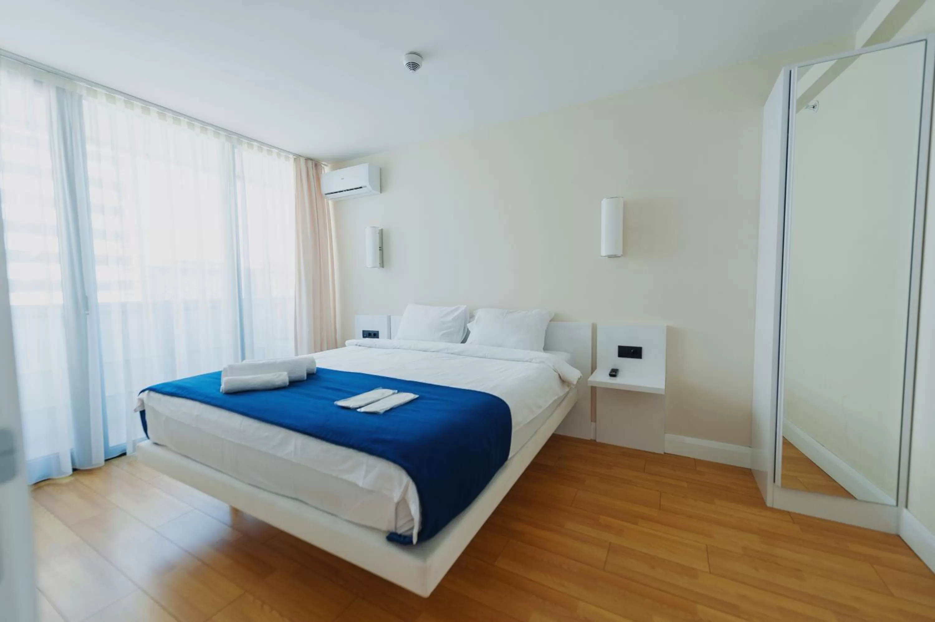 Bed in Orbi City Luxury Suite
