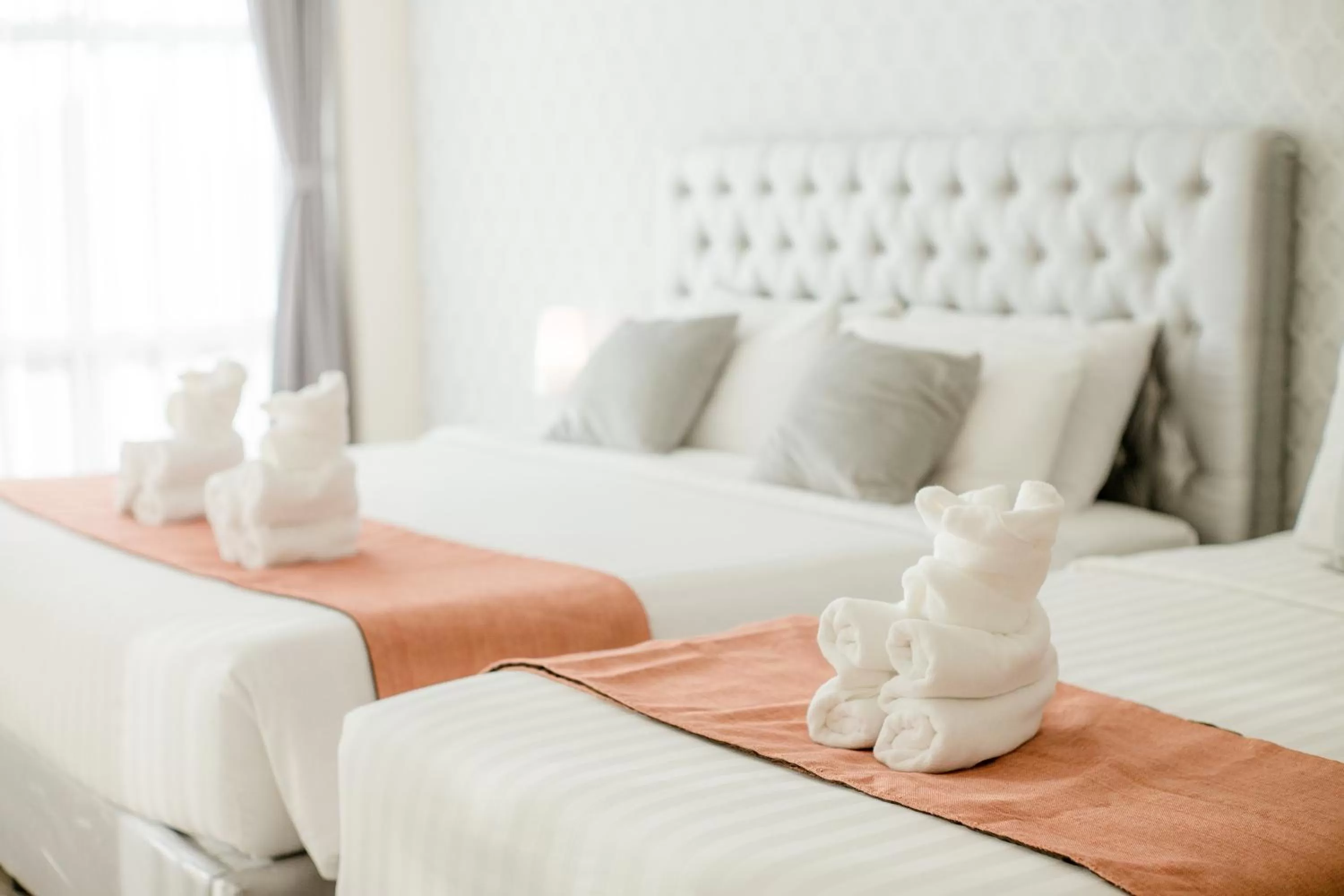 Bed in De Hug Hotel & Residence