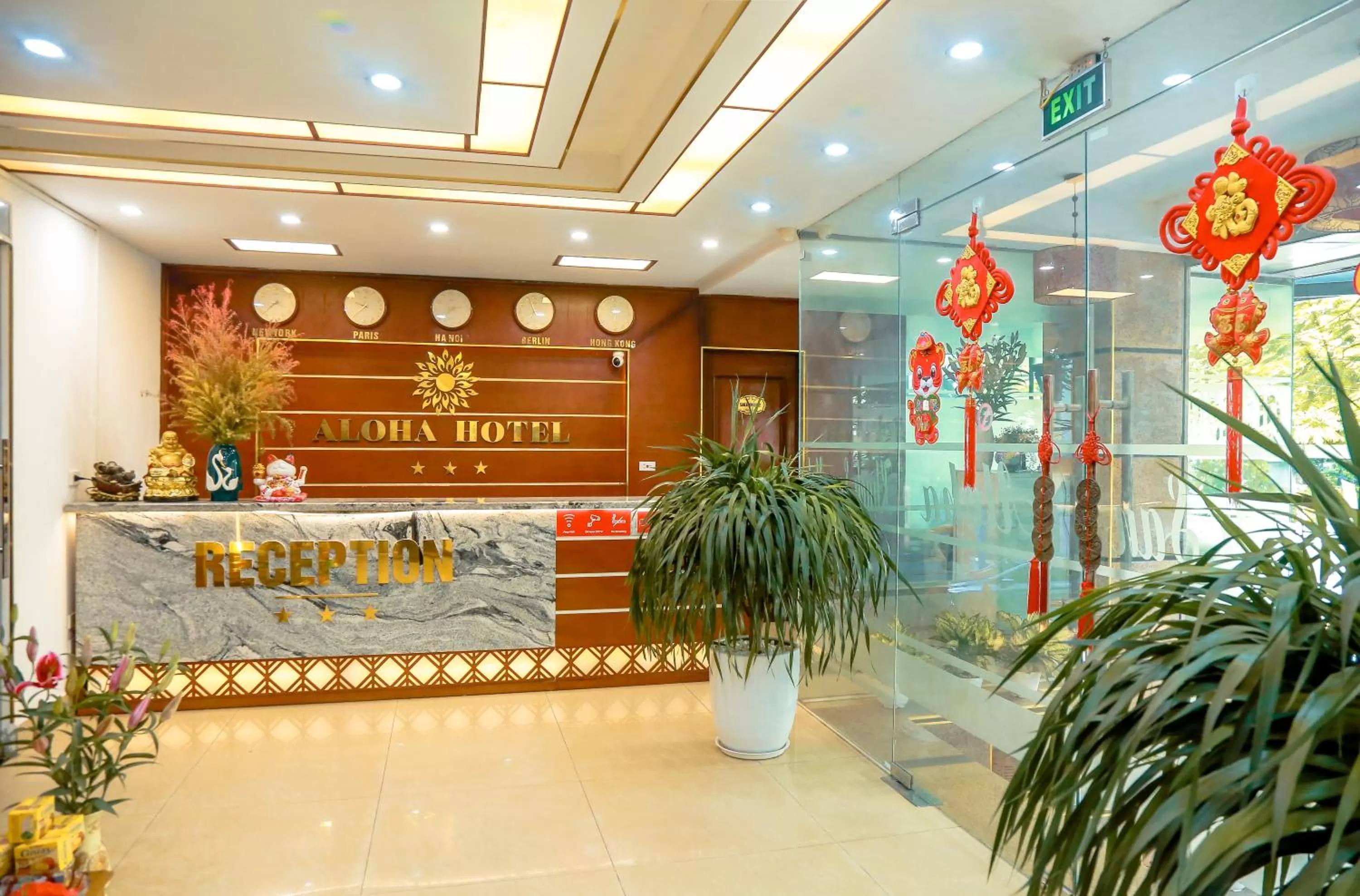 Property logo or sign in Aloha Hotel